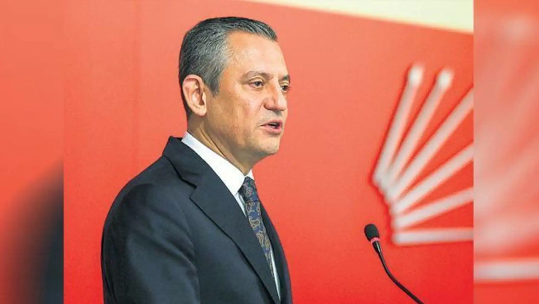 A man standing in front of a microphone.