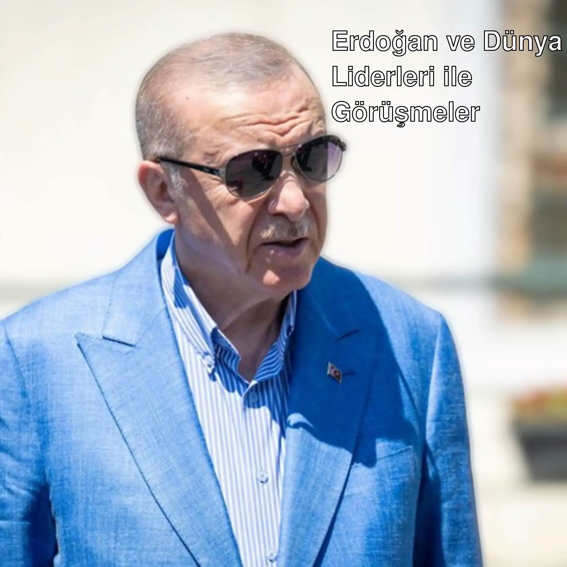 Cumhurbaşkanı Erdoğan, mavi takım elbise ve güneş gözlüğüyle. Cumhurbaşkanı Erdoğan, mavi takım elbise ve güneş gözlüğüyle.
