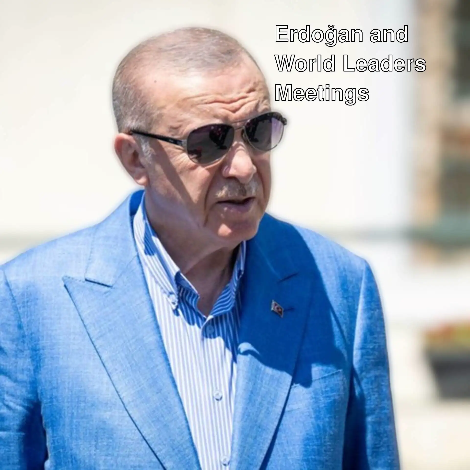 President Erdoğan in a blue suit and sunglasses.