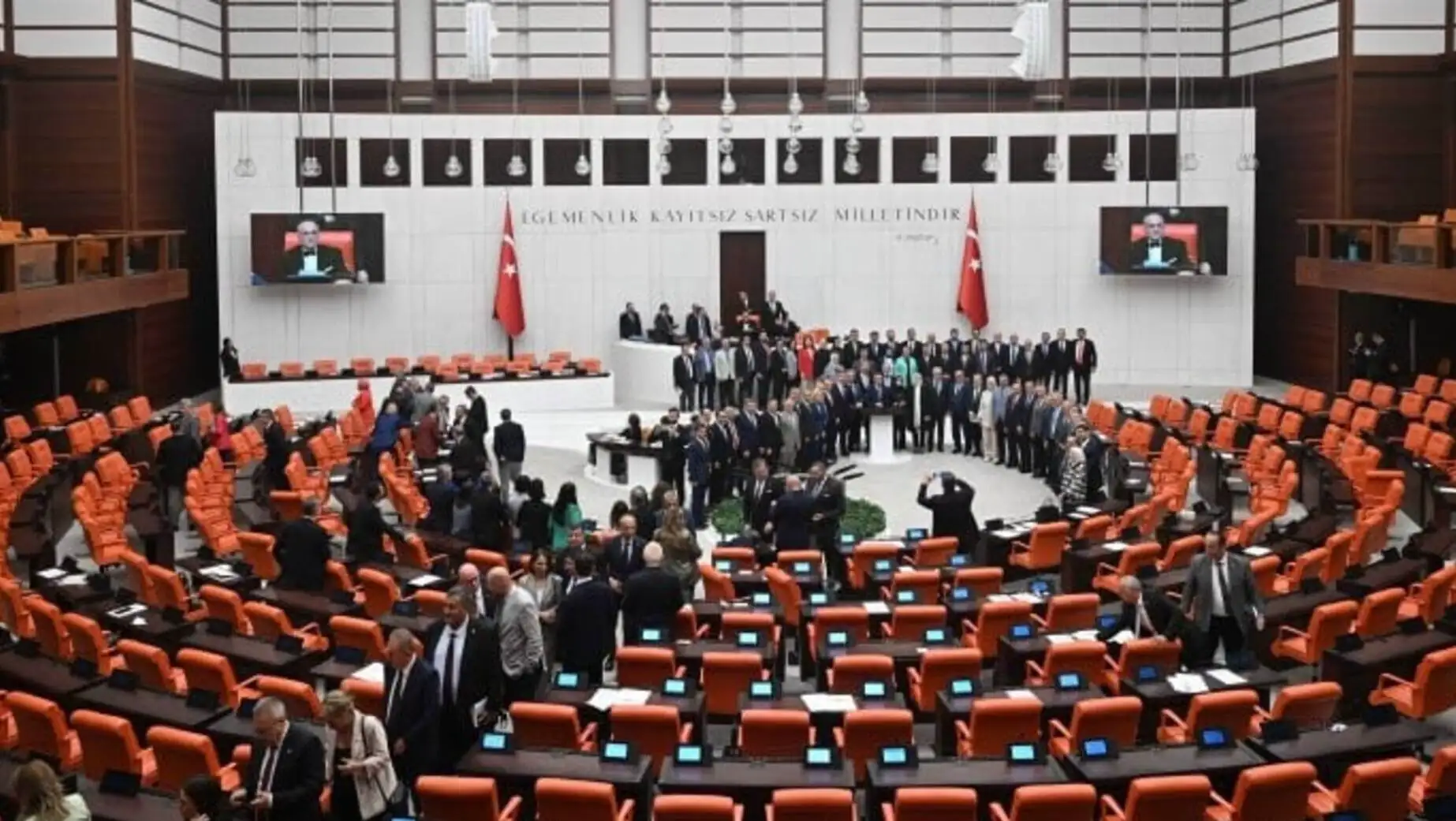 A group of people in a room A group of people in a room