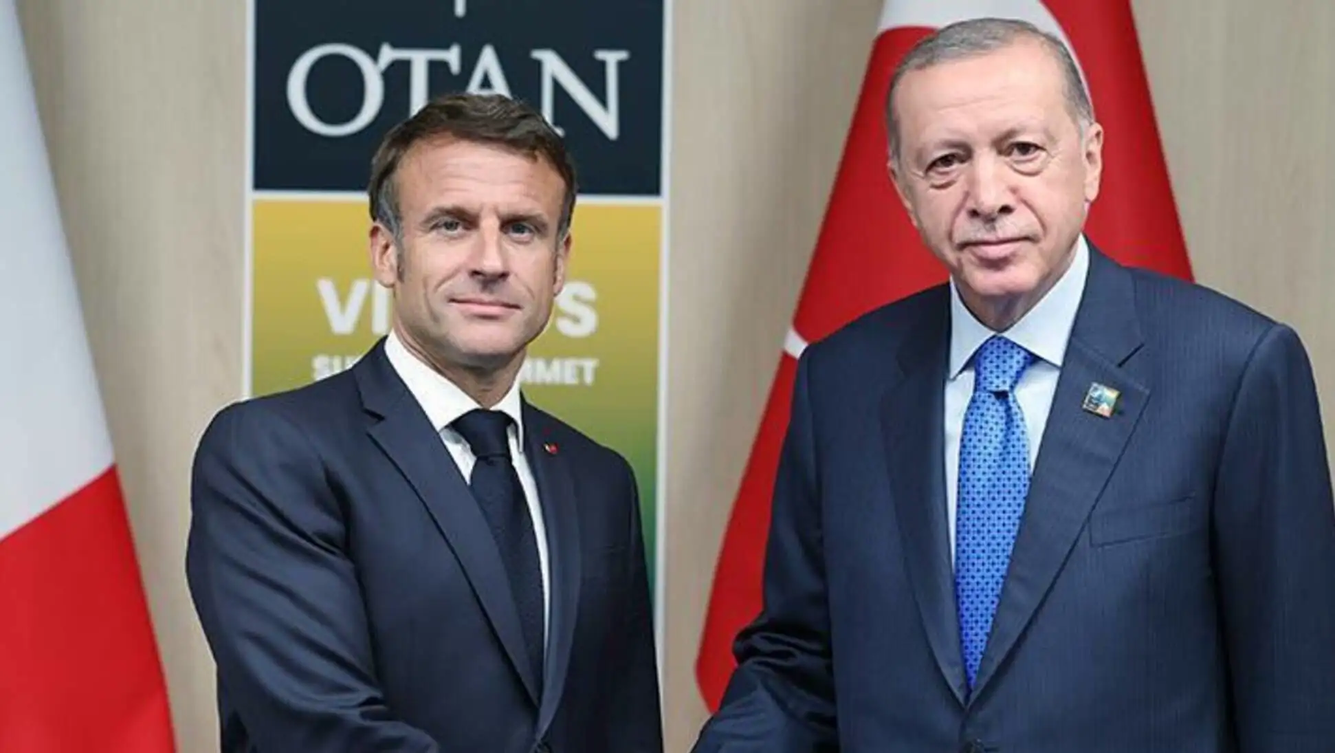 President Erdoğan and Macron shaking hands. President Erdoğan and Macron shaking hands.