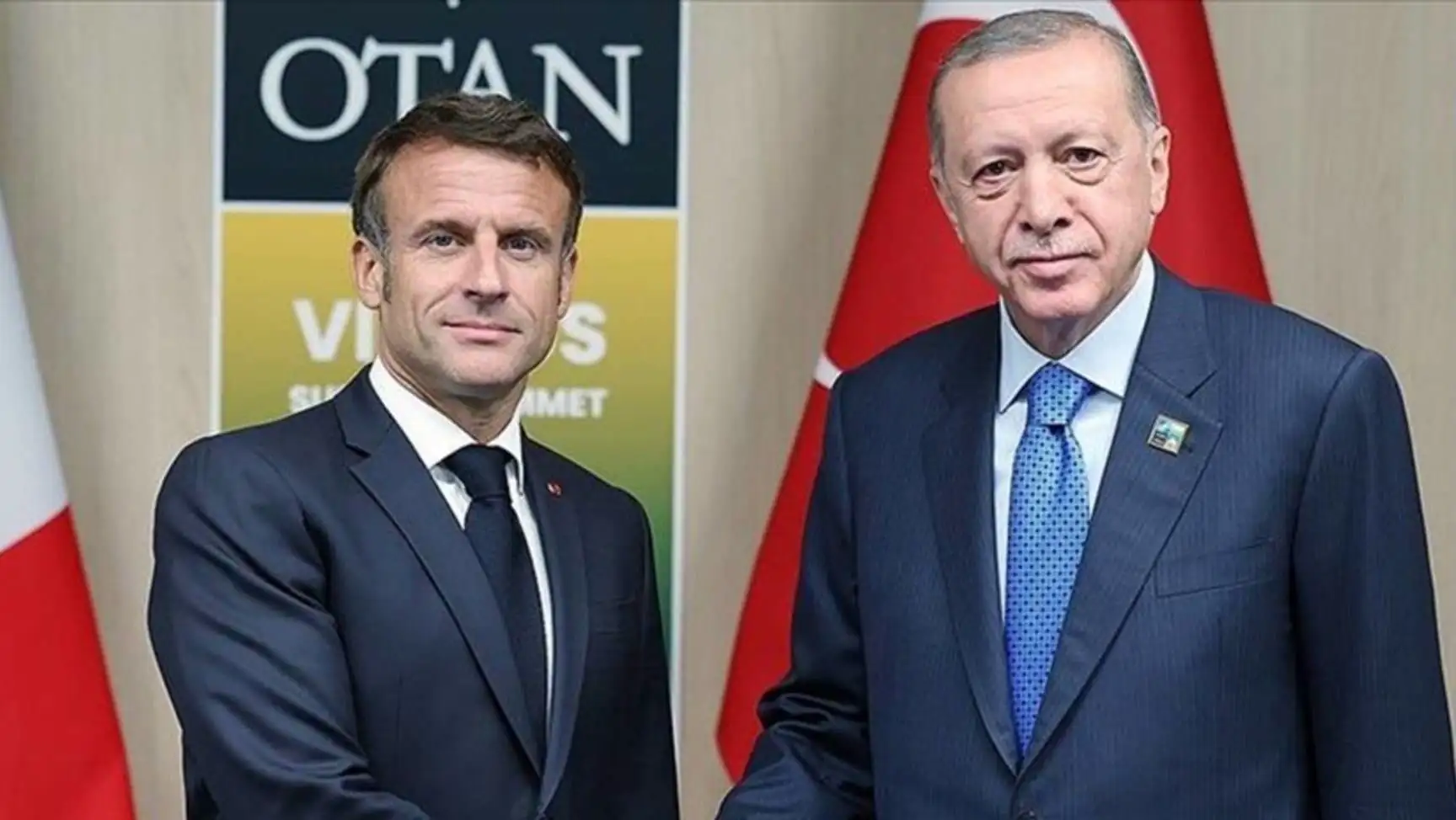 President Erdoğan and Macron shake hands. President Erdoğan and Macron shake hands.