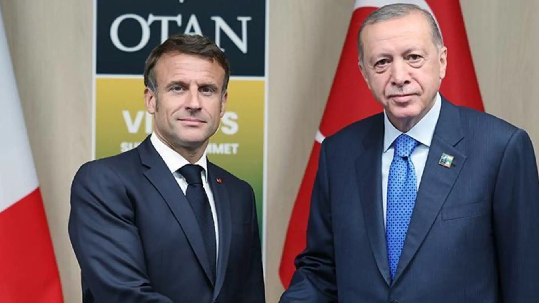 President Erdoğan and Macron shake hands. President Erdoğan and Macron shake hands.