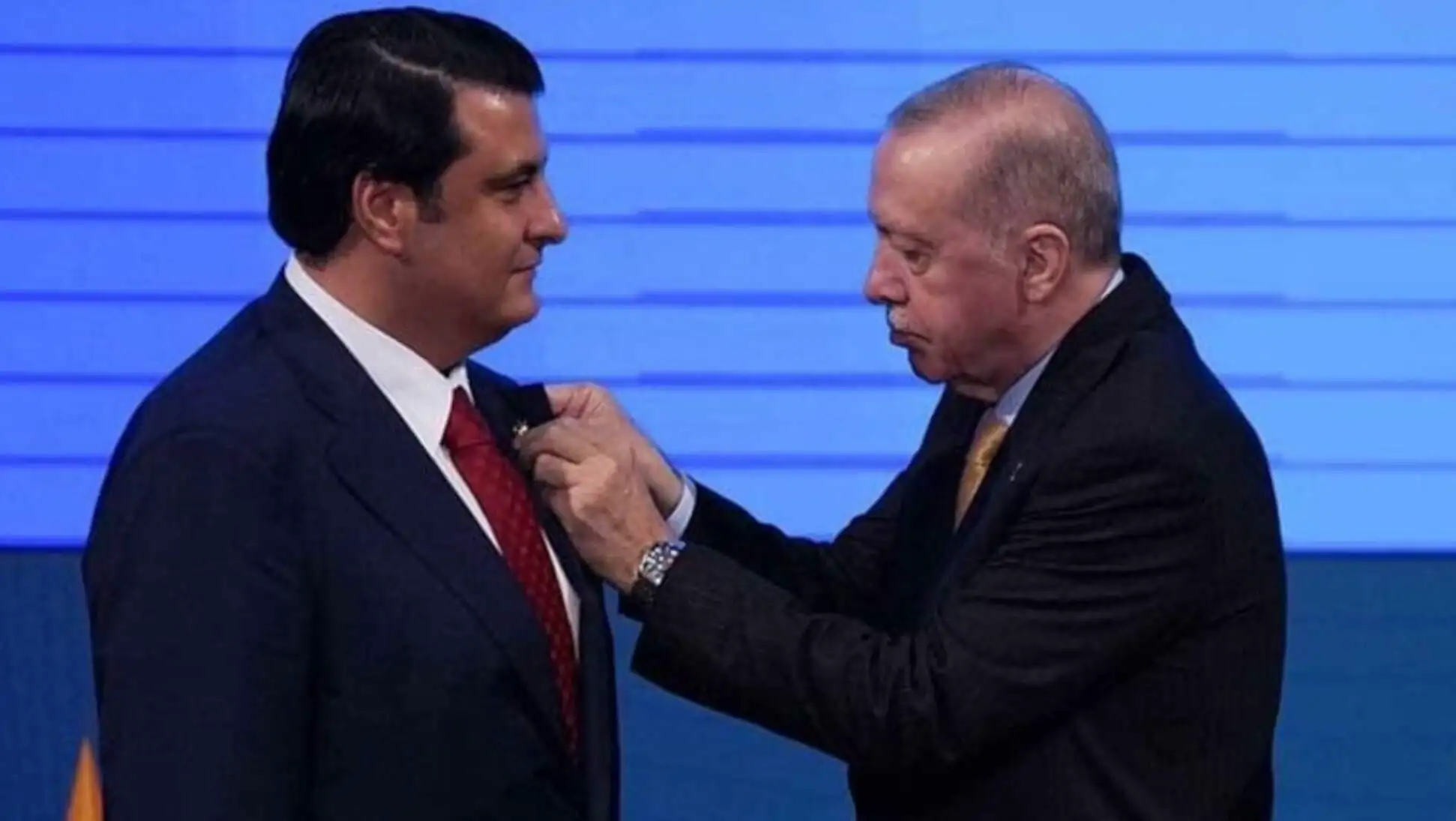 A man fixing a tie. A man fixing a tie.