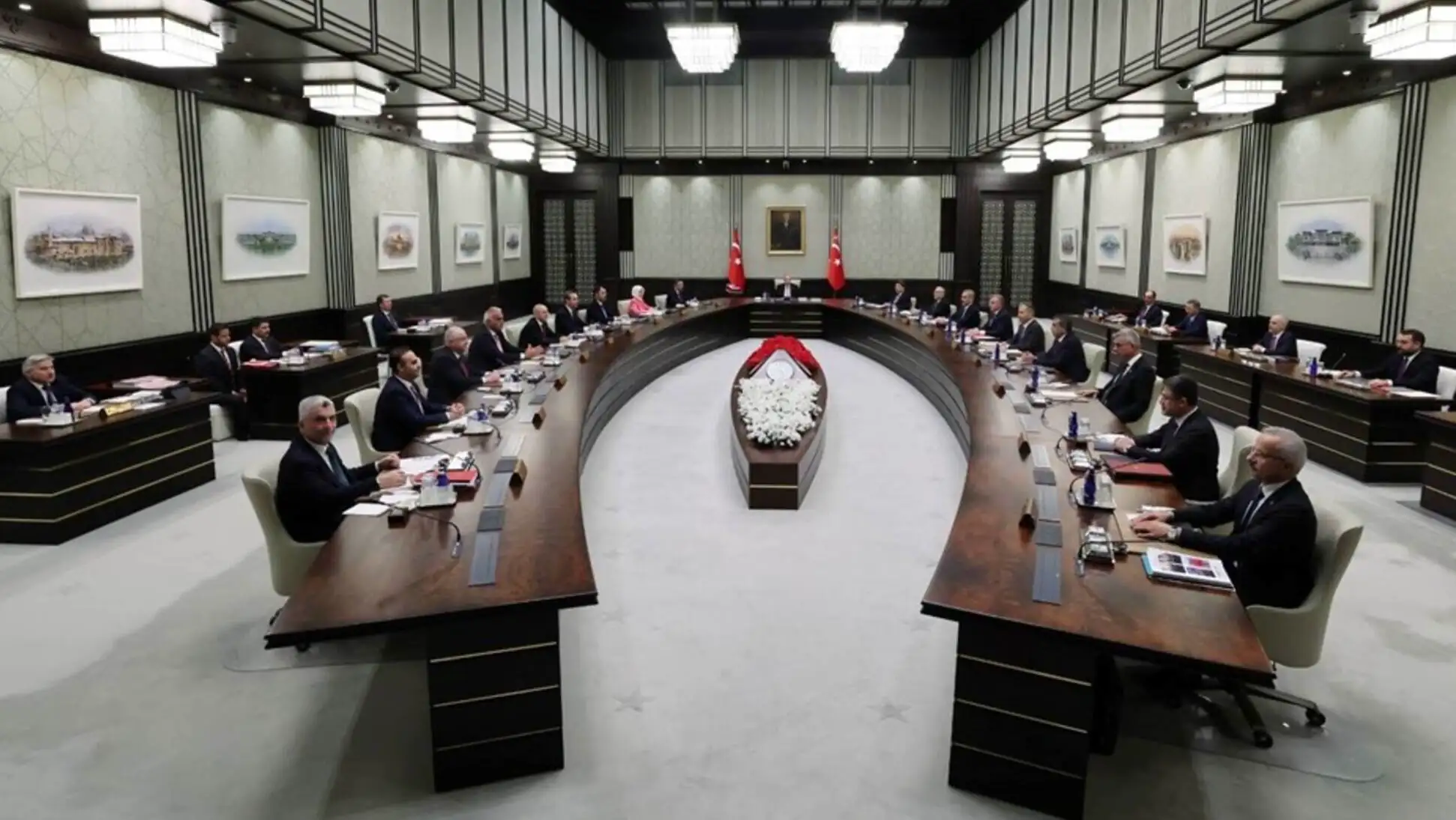 A group of people sitting at a cabinet meeting.