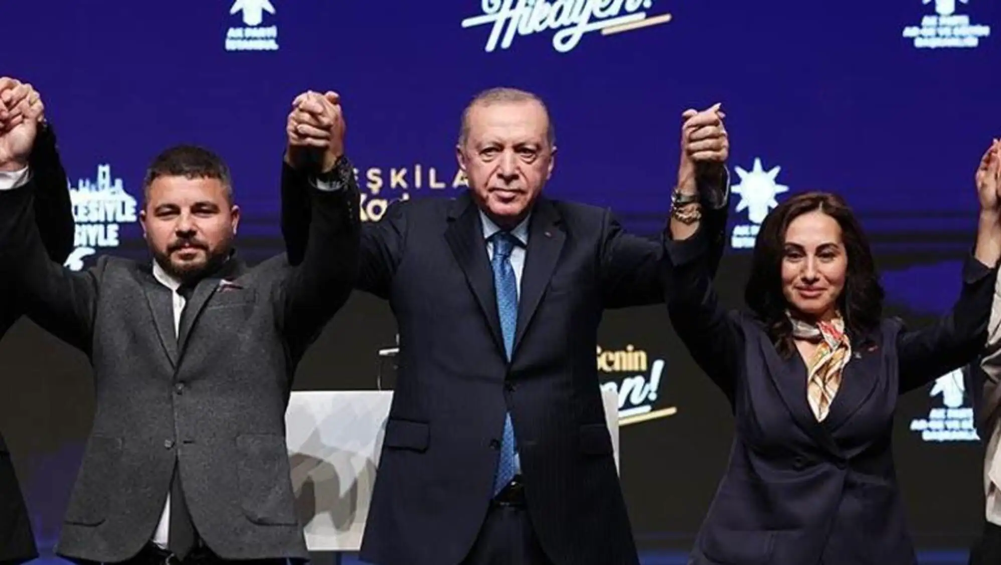 A group of people applauding.