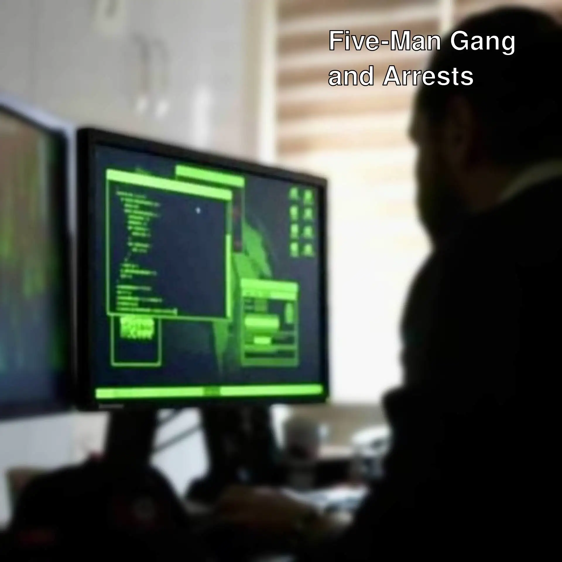 A man sitting at a desk with two computer screens