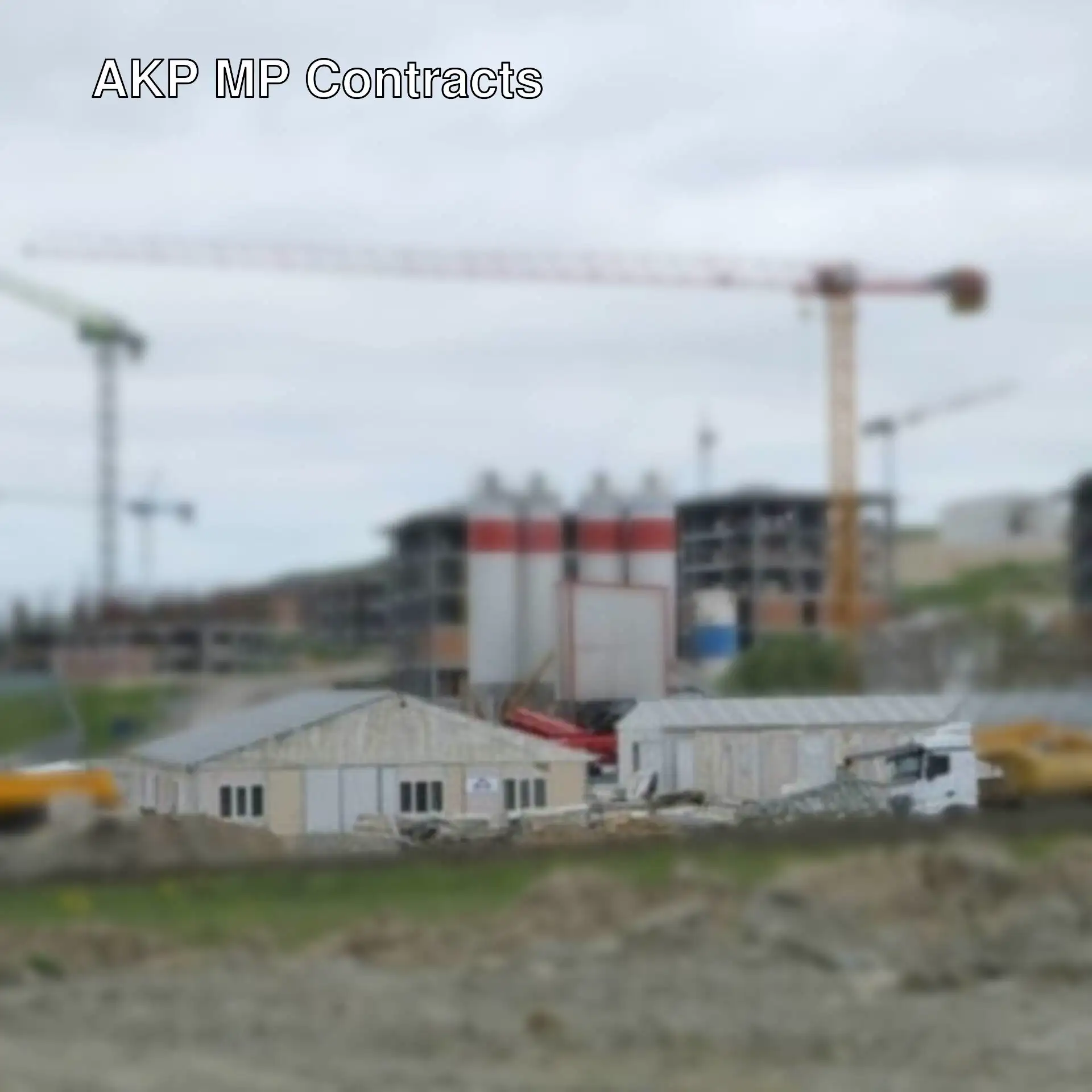 A construction site with cranes and buildings.