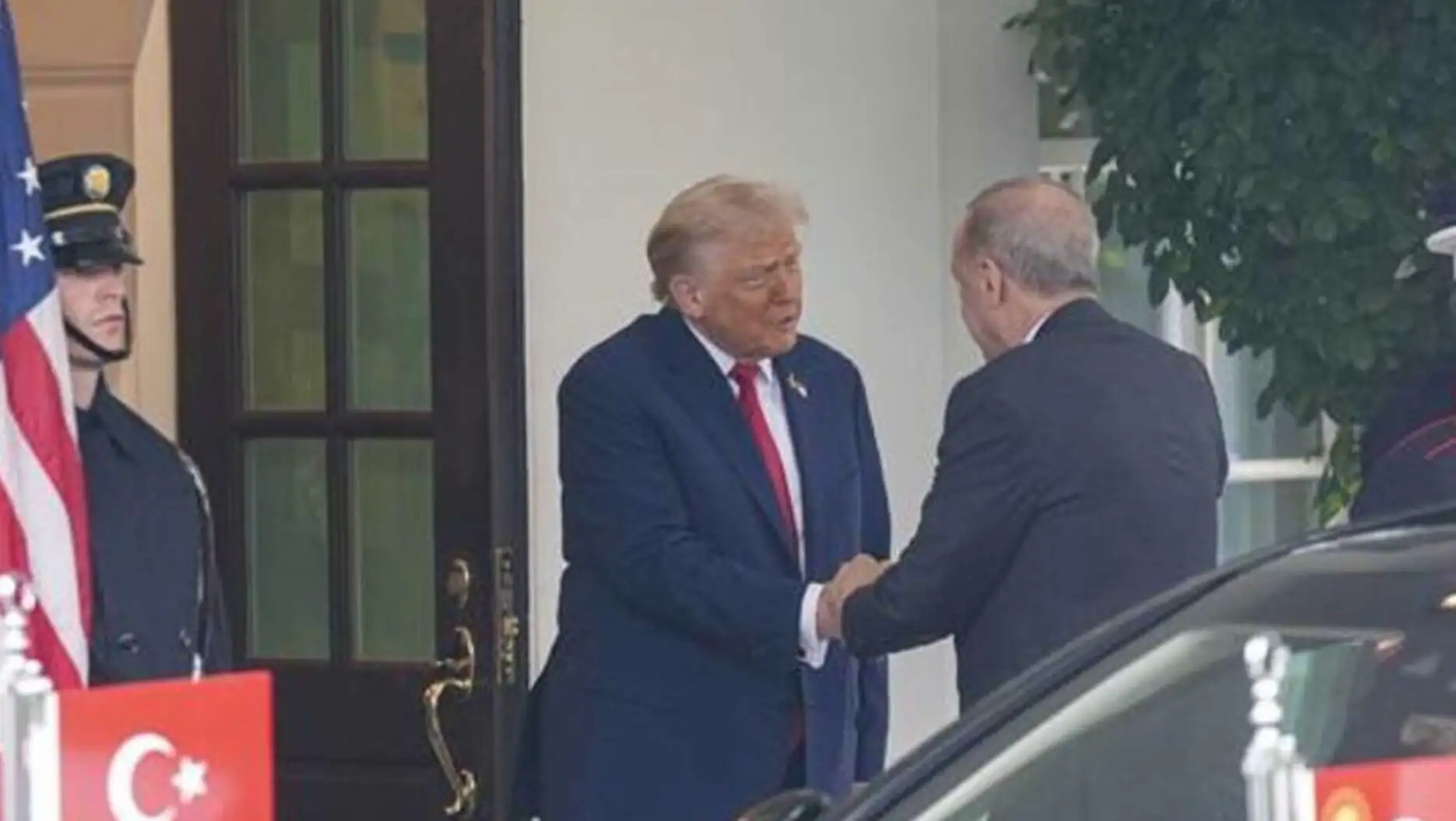 President Erdoğan and Trump shake hands after their meeting.