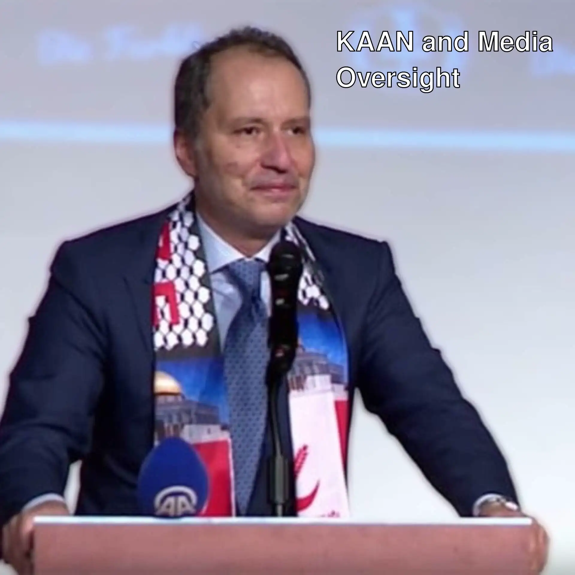 A man standing at a podium with a microphone.