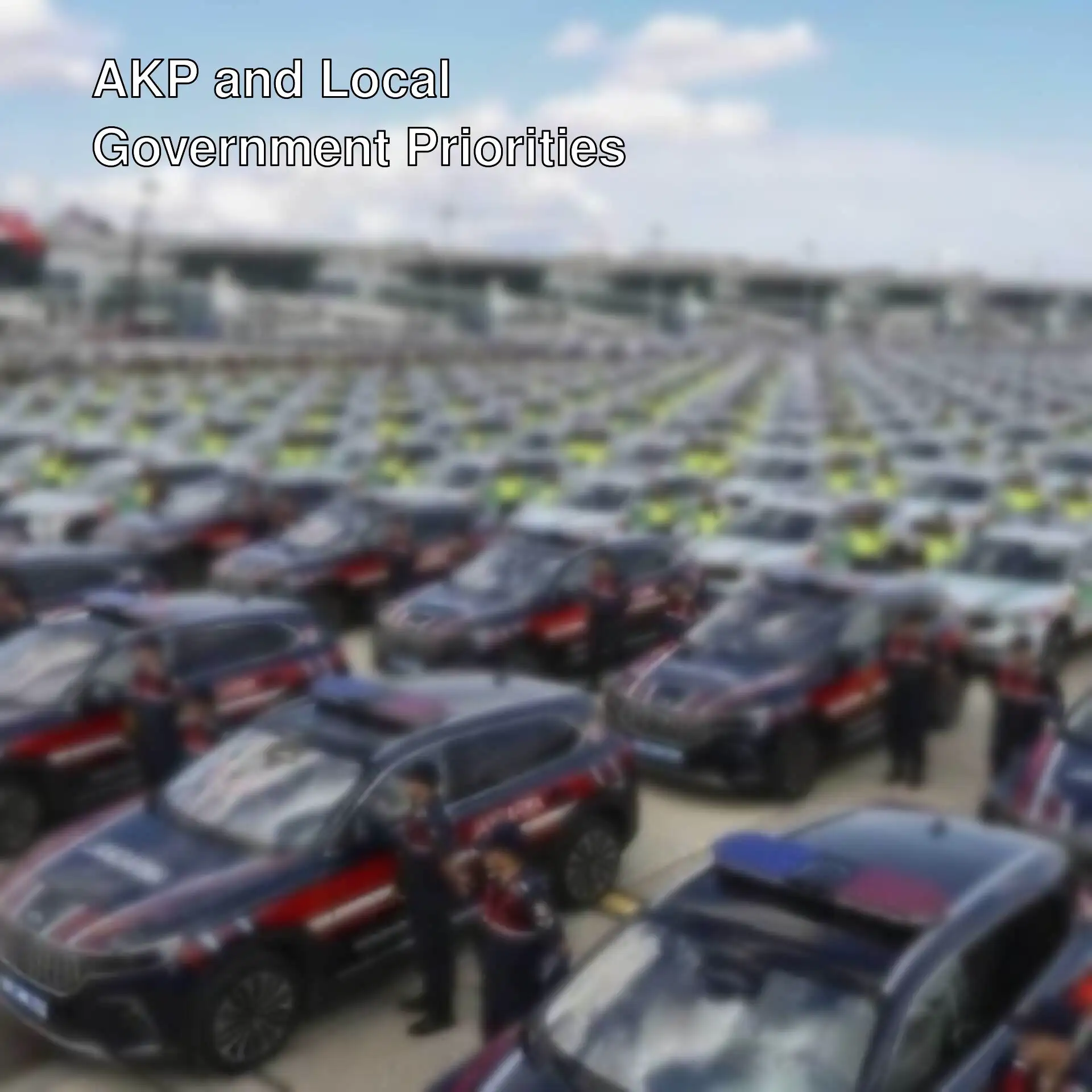 A group of police cars parked in a parking lot.