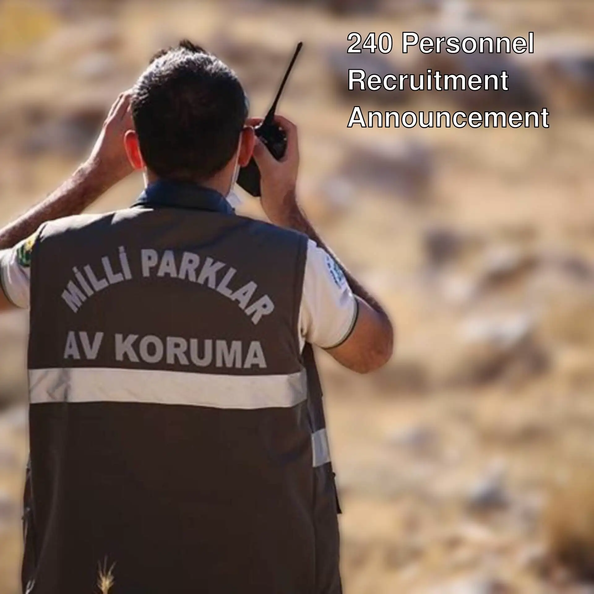 A man holding a walkie-talkie.