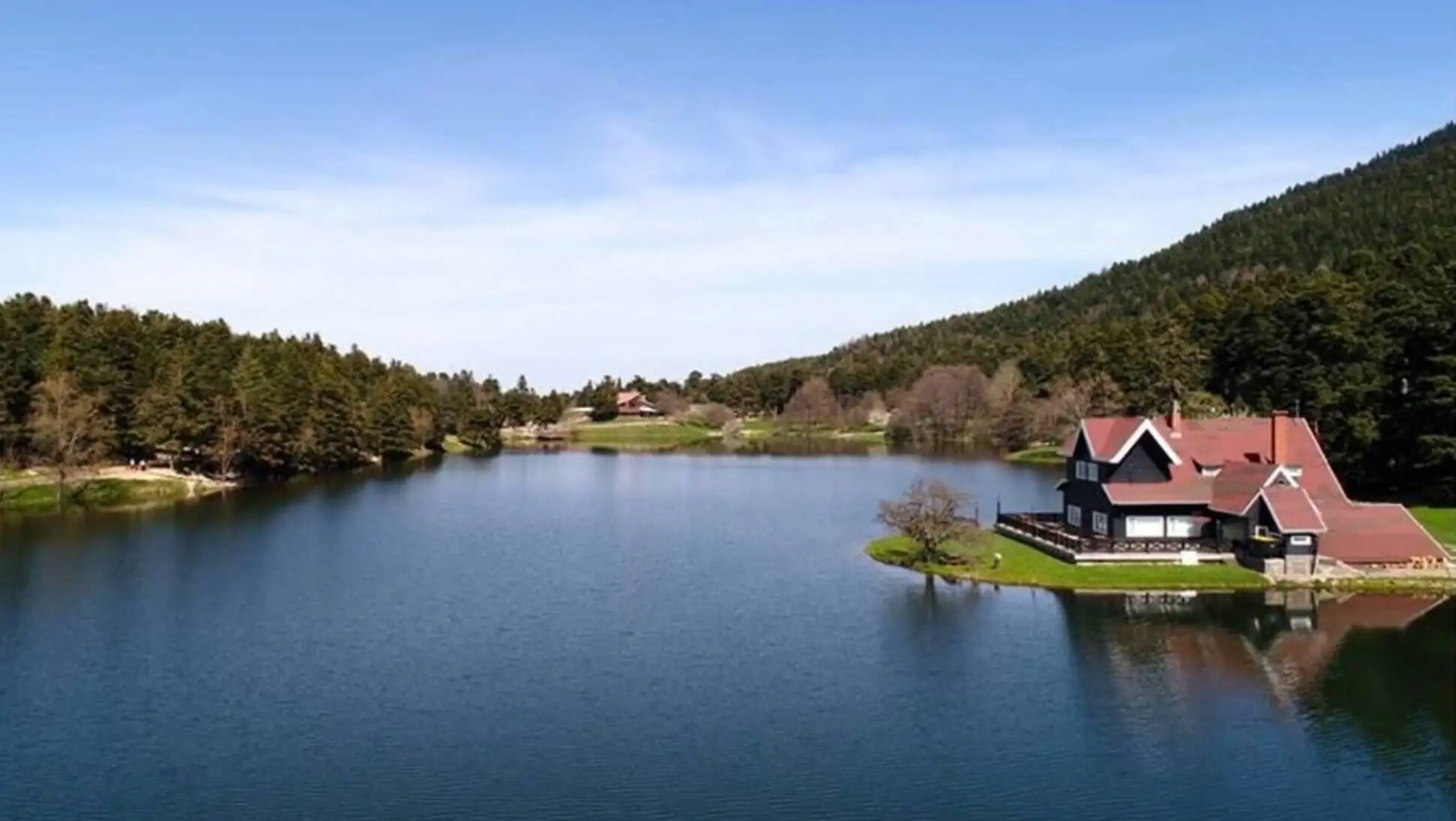 A house on a small island in a lake. A house on a small island in a lake.