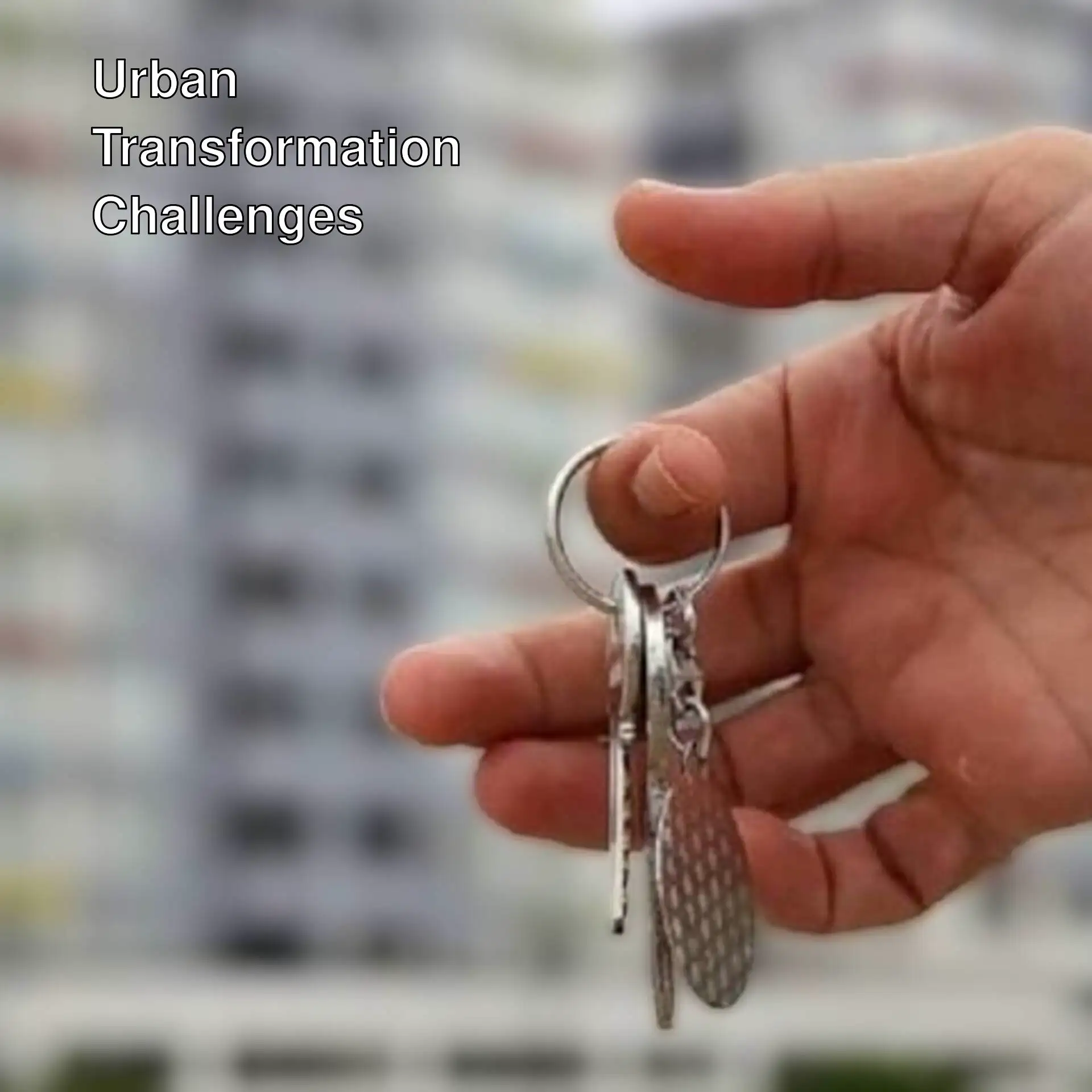 A hand holding a keychain. A hand holding a keychain.