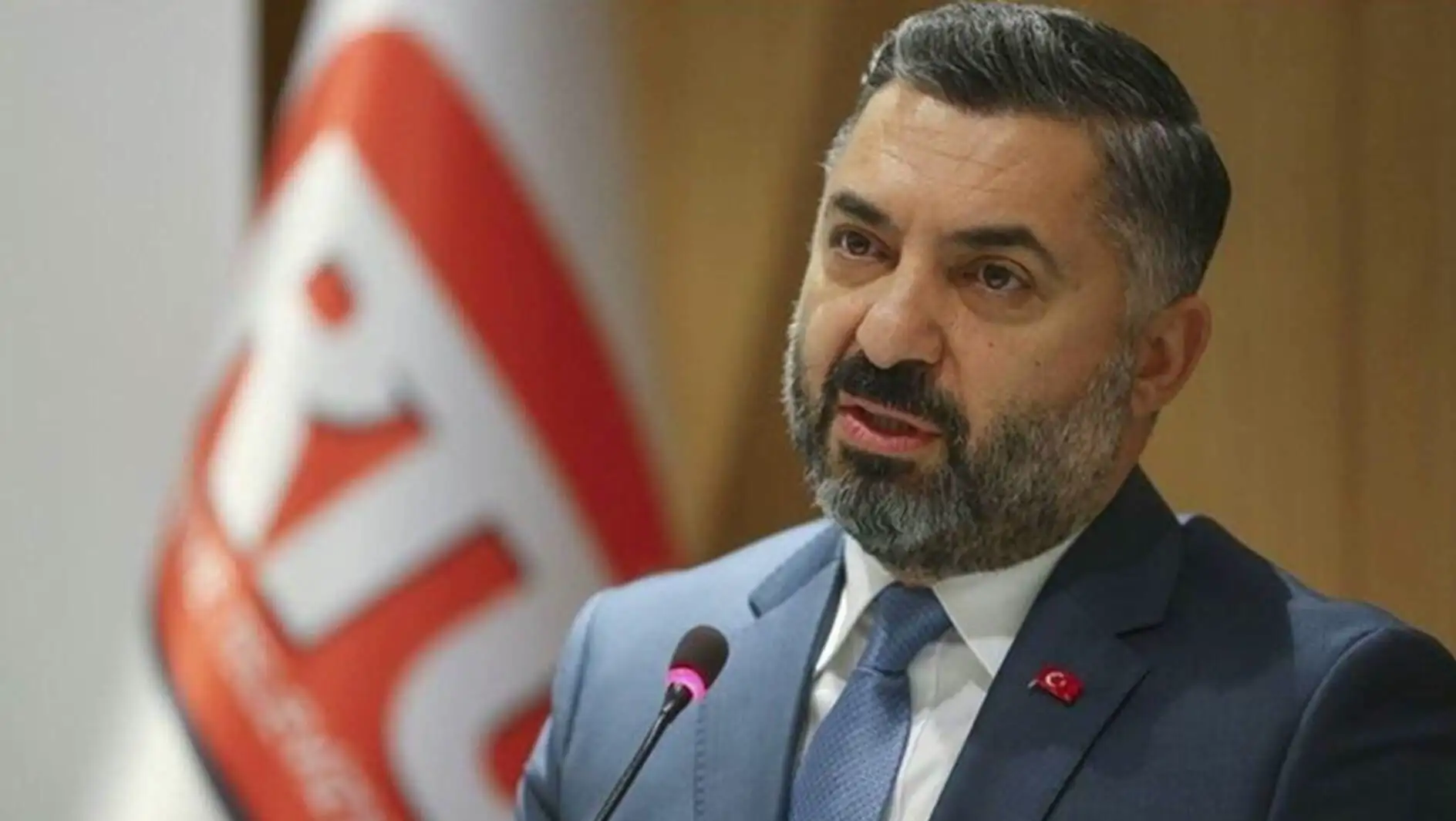 RTÜK President Ebubekir Şahin speaks into a microphone. RTÜK President Ebubekir Şahin speaks into a microphone.