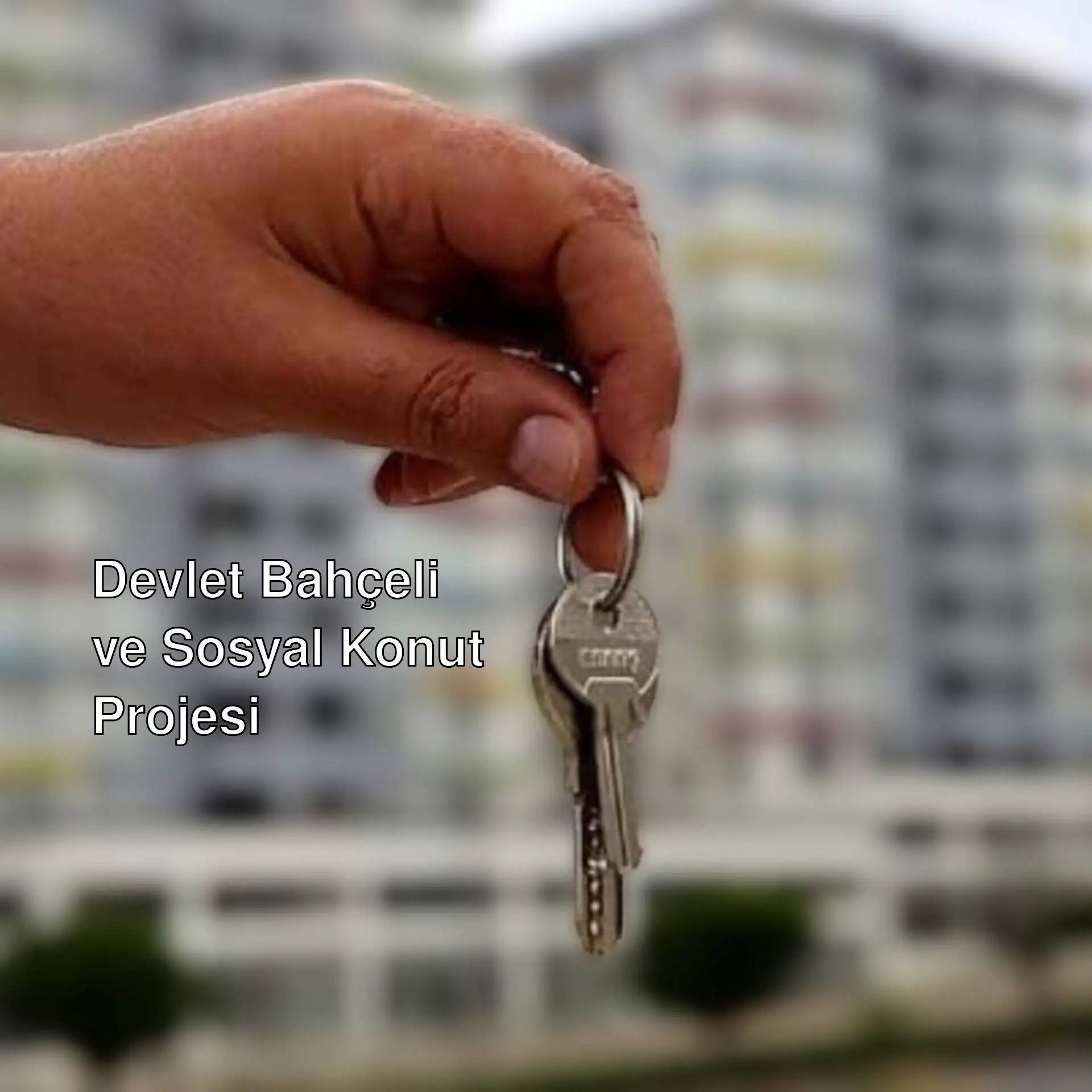 Anahtar tutan bir el, sosyal konut projesi ile ilgili.