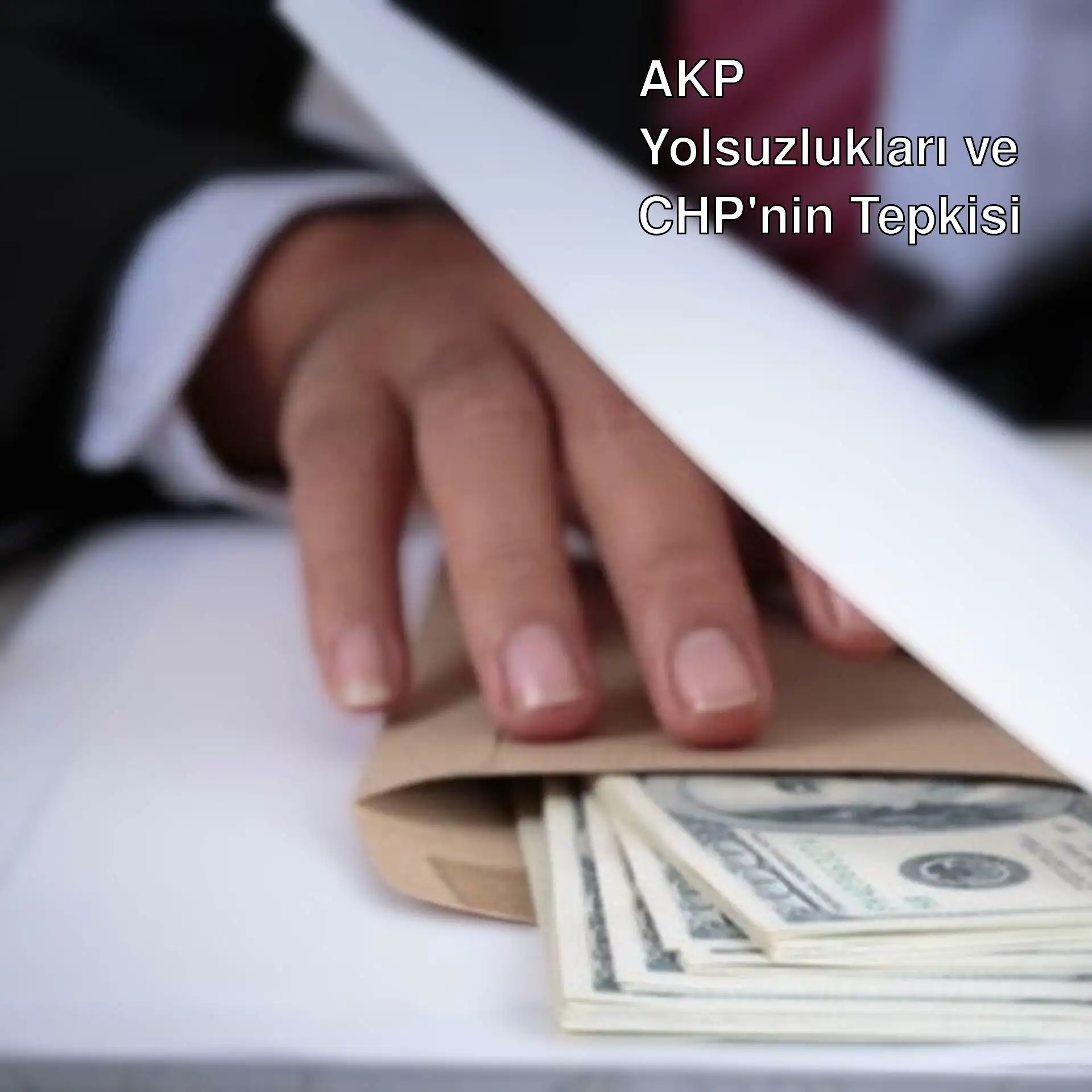 Bir el zarfın içine para koyuyor.