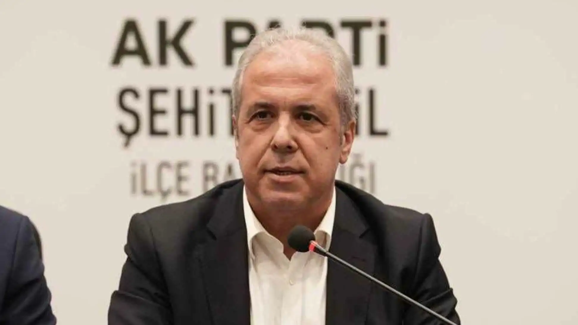 A man speaking into a microphone.