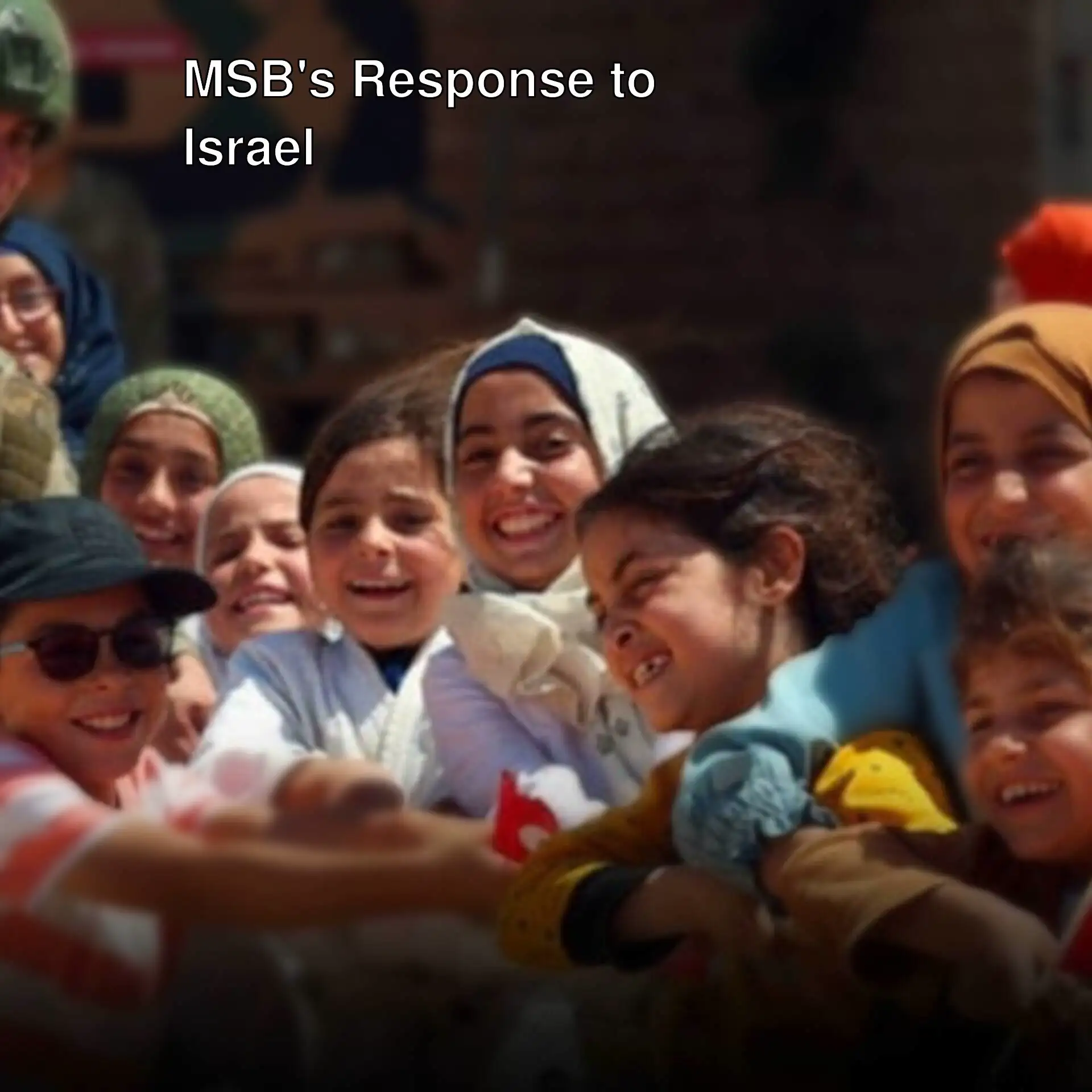 A group of children smiling.