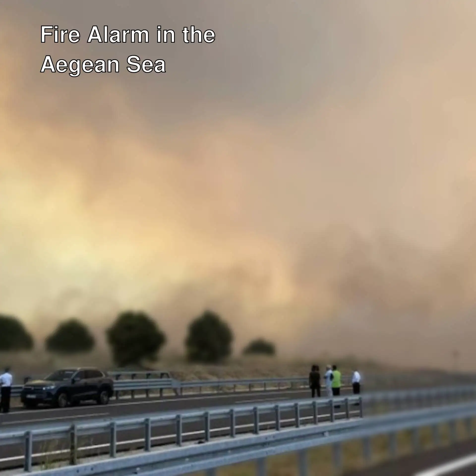People standing on the road due to the fire. People standing on the road due to the fire.