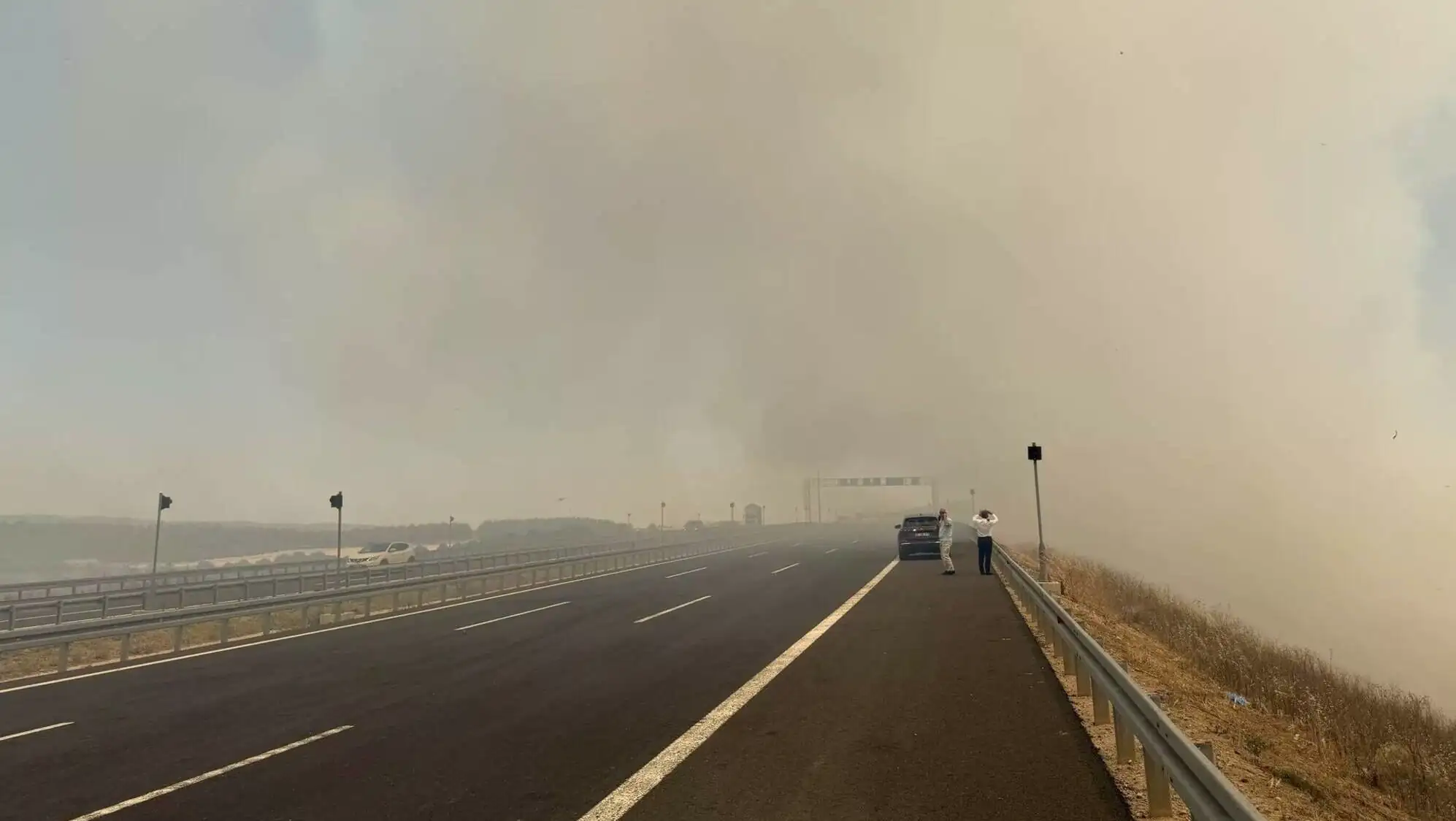 A vehicle on the road closed due to the fire. A vehicle on the road closed due to the fire.