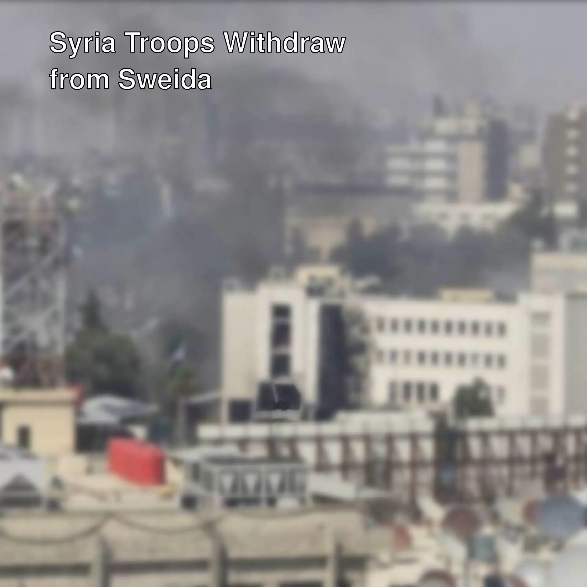 A city with smoke coming out of it.