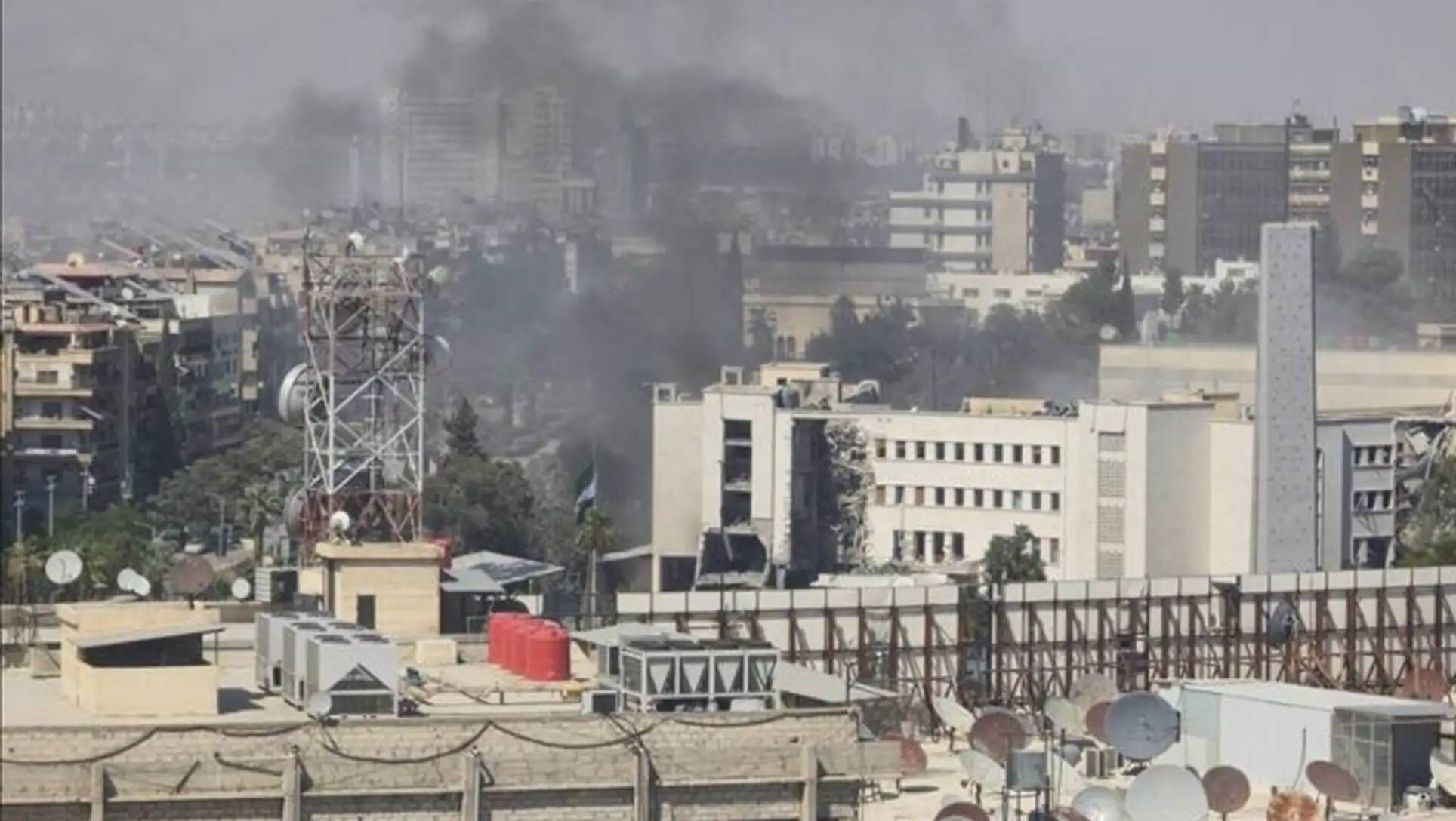A city with smoke coming out of it. A city with smoke coming out of it.