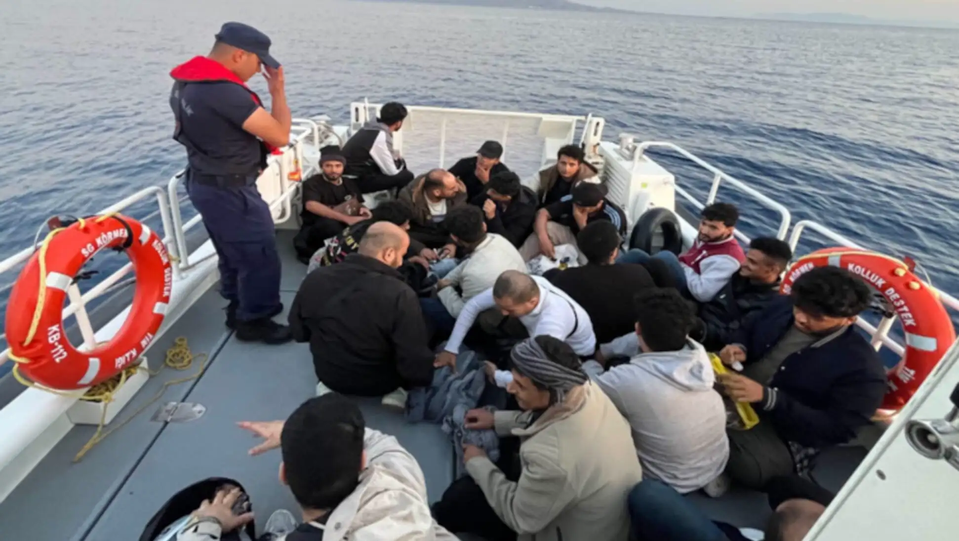 A boat with migrants in the Aegean Sea. A boat with migrants in the Aegean Sea.