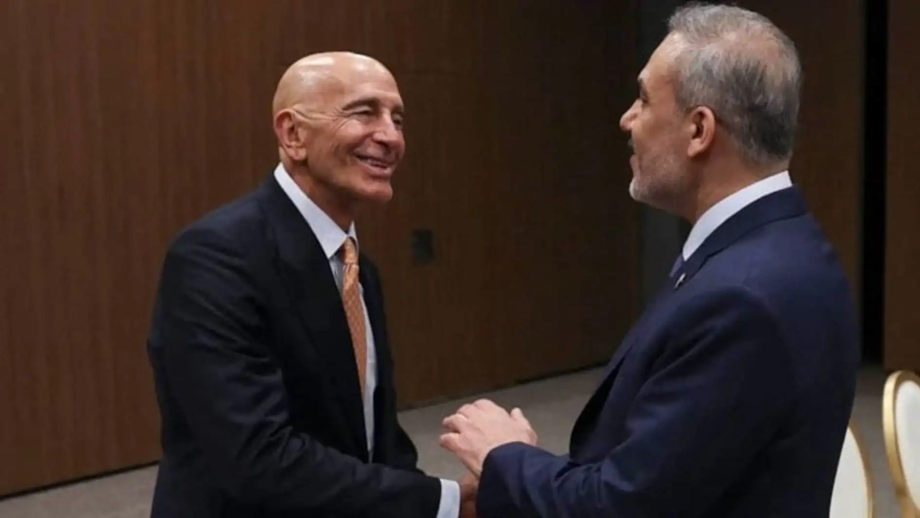 Foreign Minister Hakan Fidan and his Syrian counterpart shaking hands. Foreign Minister Hakan Fidan and his Syrian counterpart shaking hands.