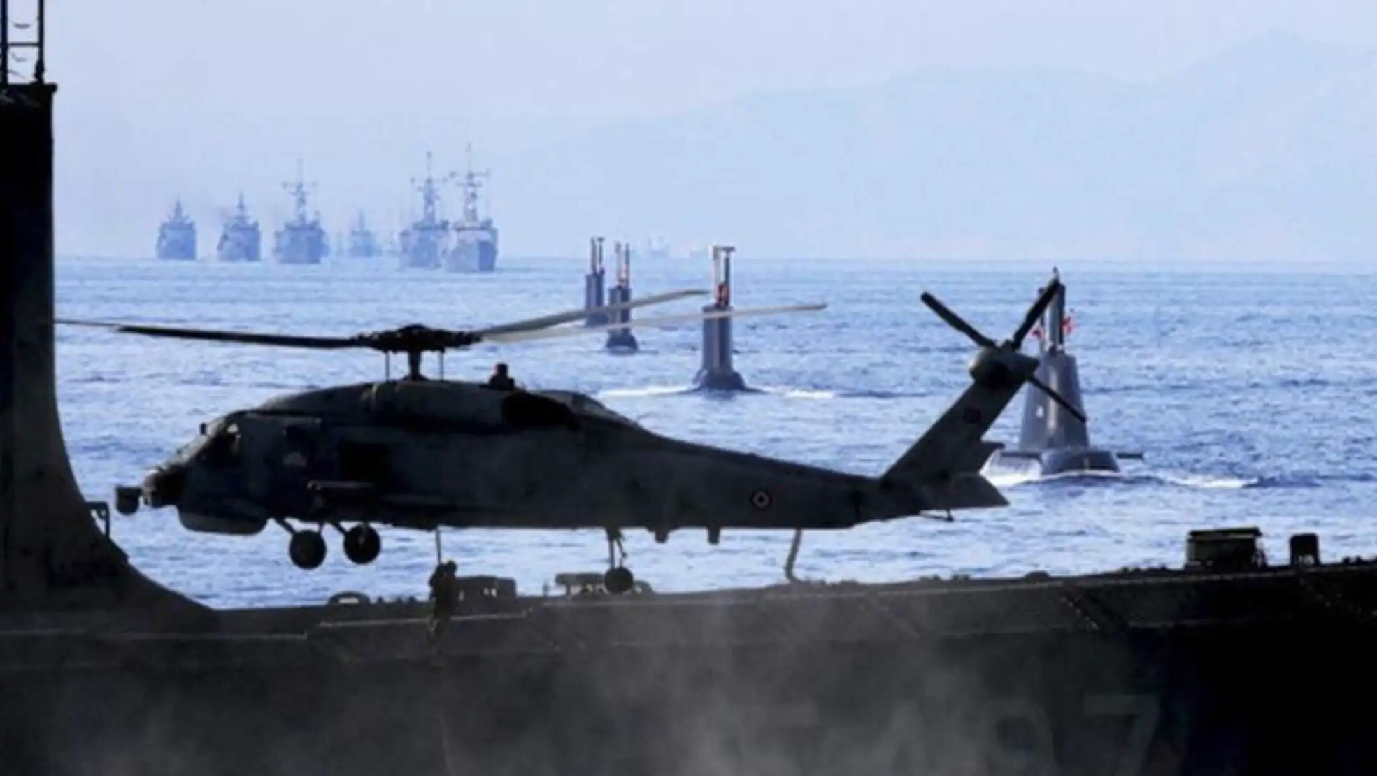 A helicopter landing on a ship A helicopter landing on a ship