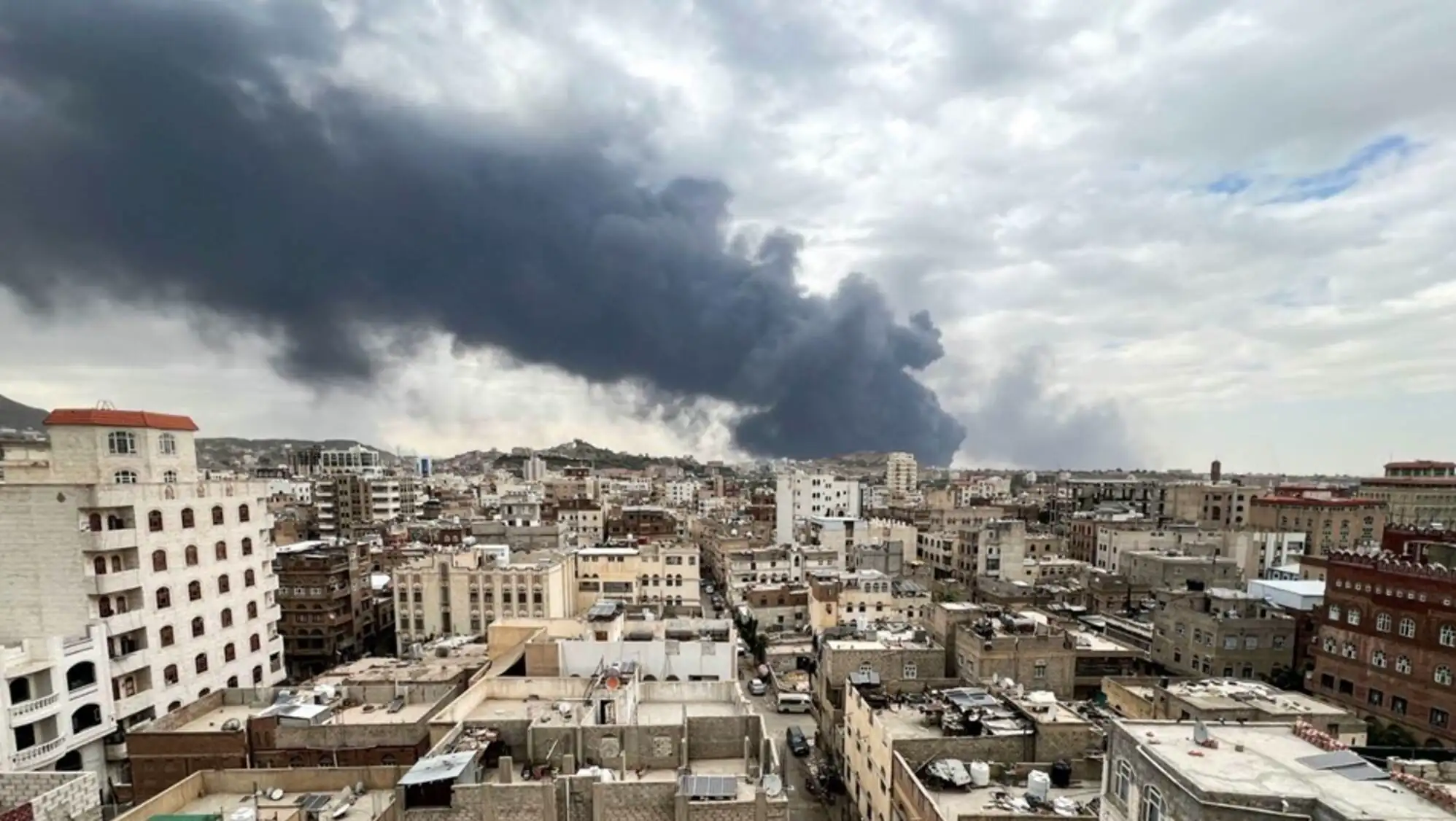 A city with smoke rising. A city with smoke rising.