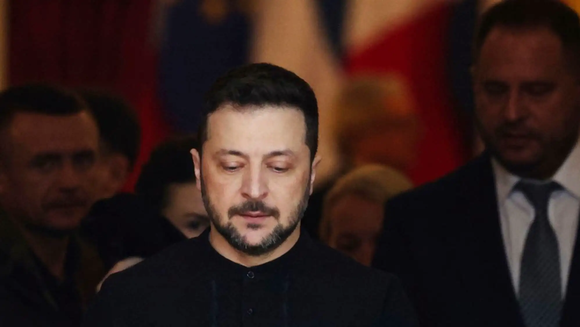 A man looking down in a crowd. A man looking down in a crowd.