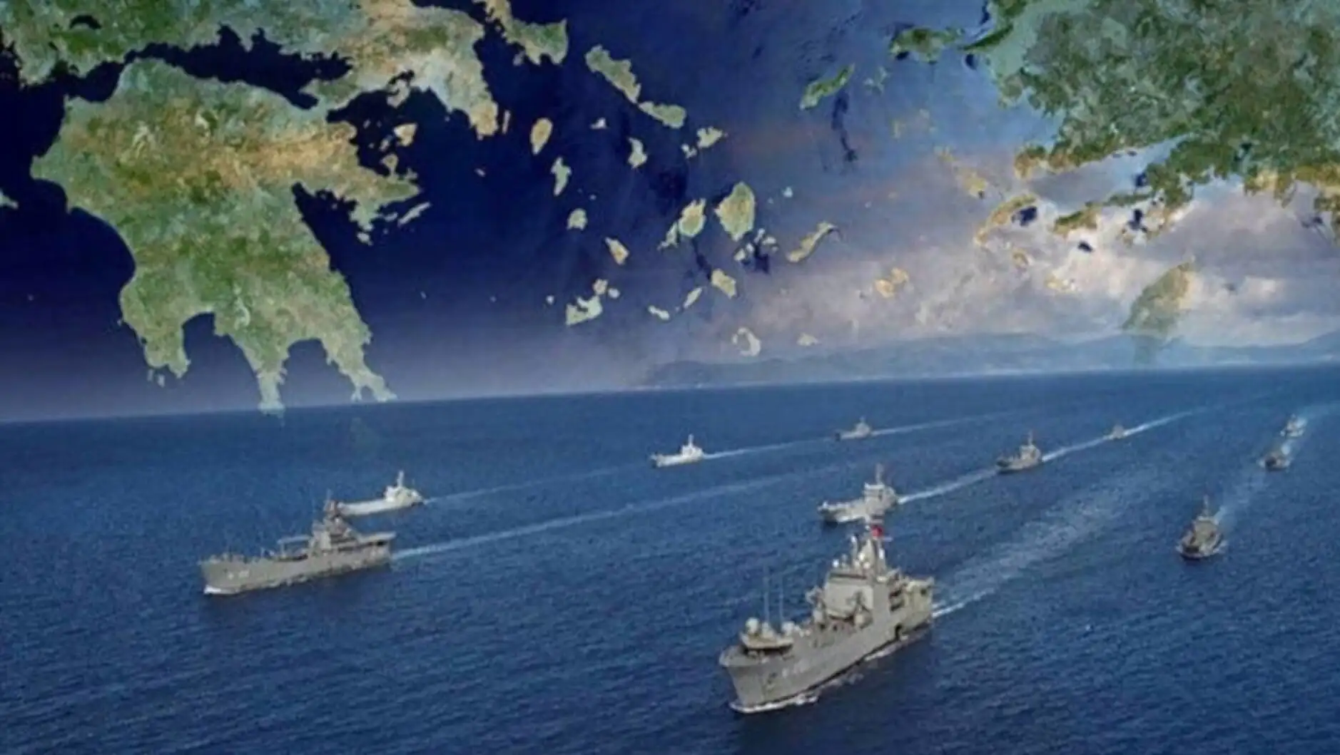 A group of military ships in the water. A group of military ships in the water.