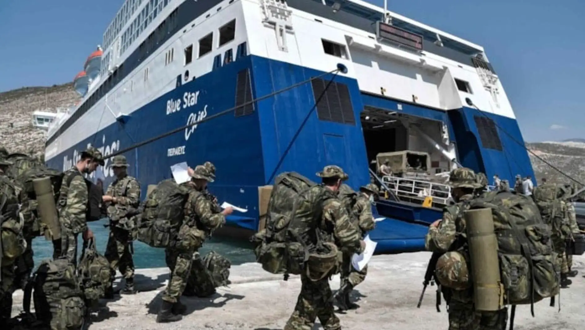 A group of soldiers walking by a large ship. A group of soldiers walking by a large ship.