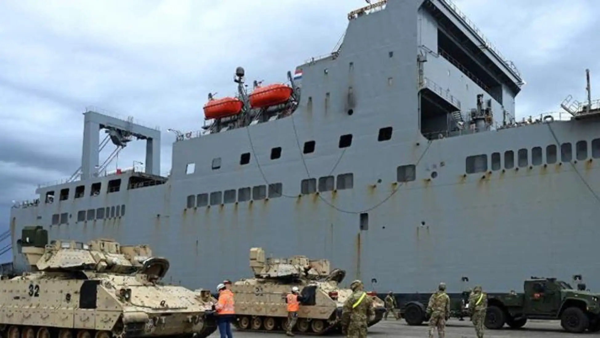 A large military ship with tanks. A large military ship with tanks.