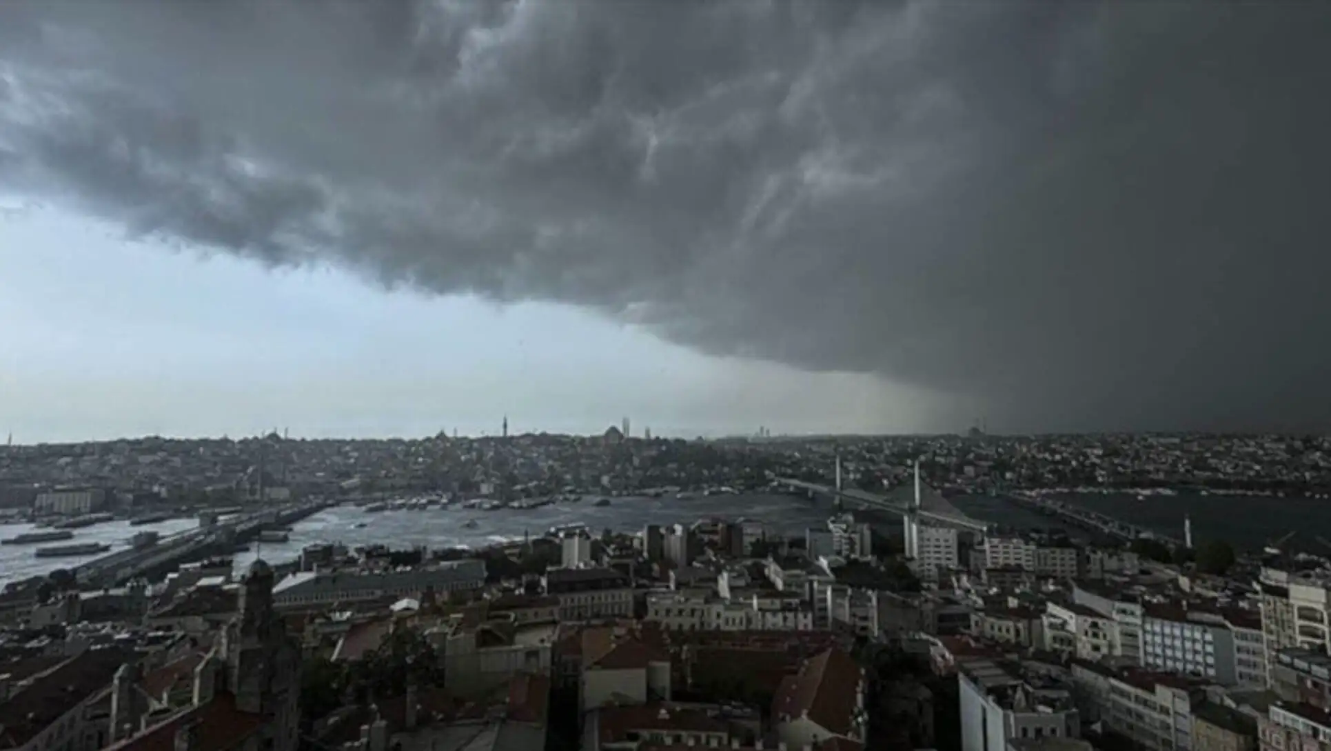 A city with a bridge and a body of water A city with a bridge and a body of water
