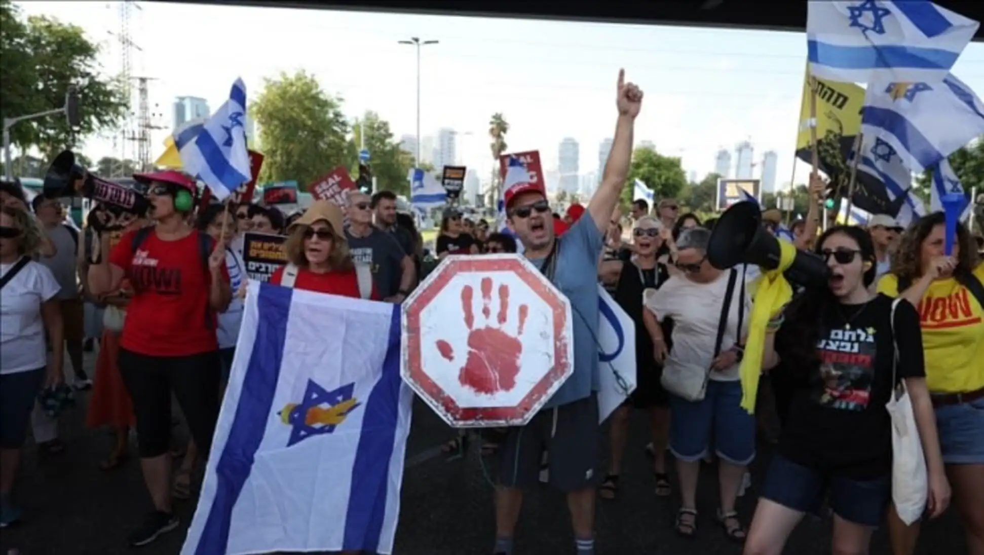 A group of people protesting in Israel. A group of people protesting in Israel.