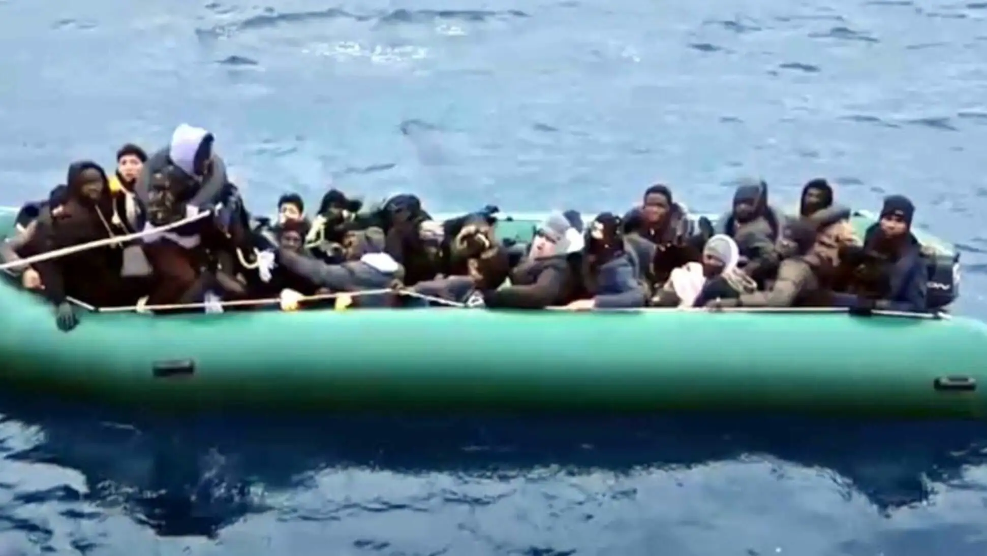 A group of migrants on a boat in the Aegean Sea. A group of migrants on a boat in the Aegean Sea.