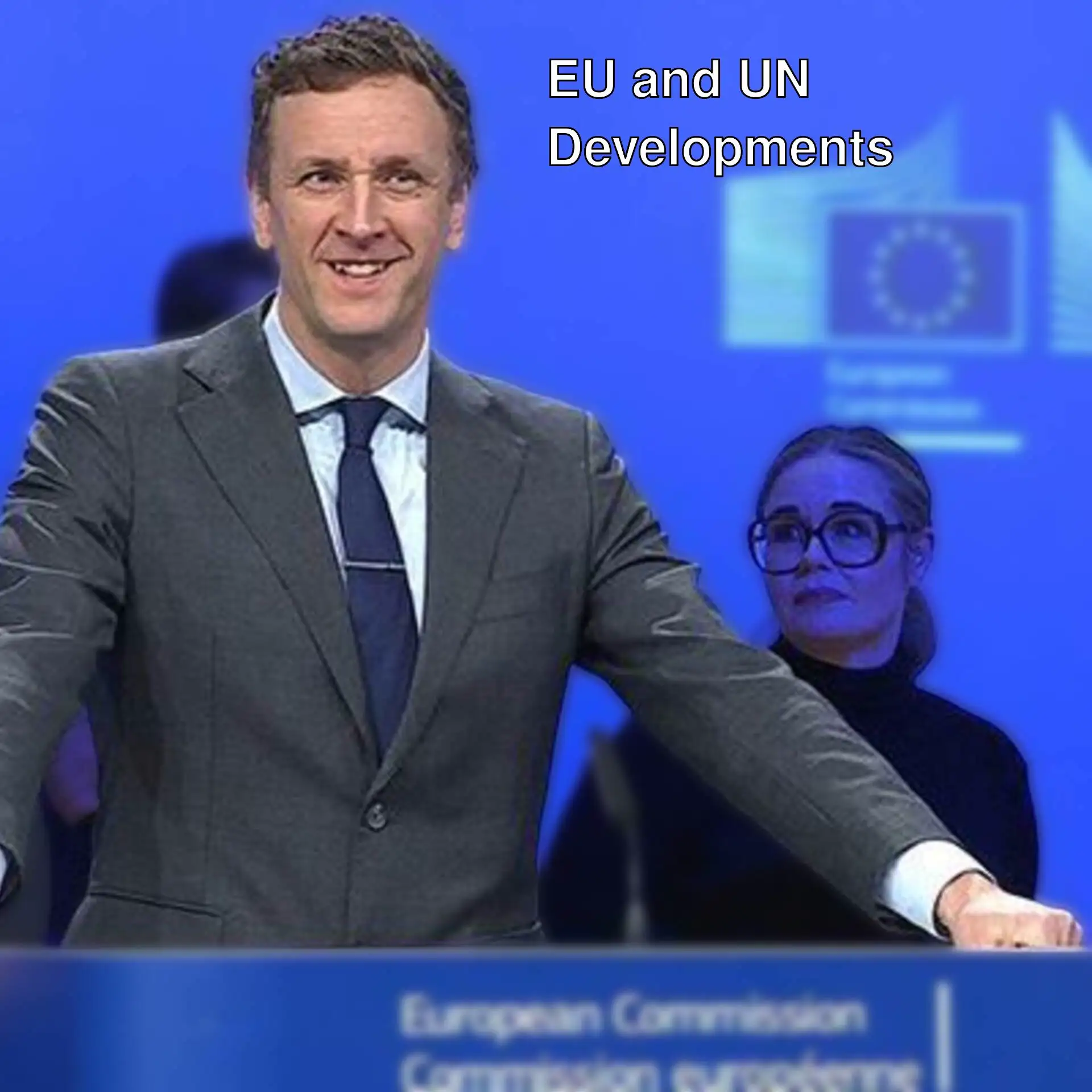 A man standing at a podium. A man standing at a podium.