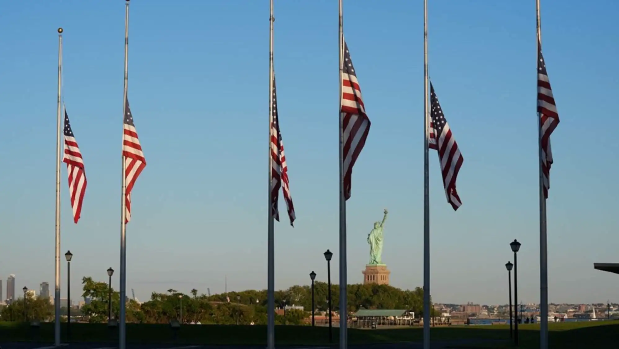 A group of American flags on poles. A group of American flags on poles.