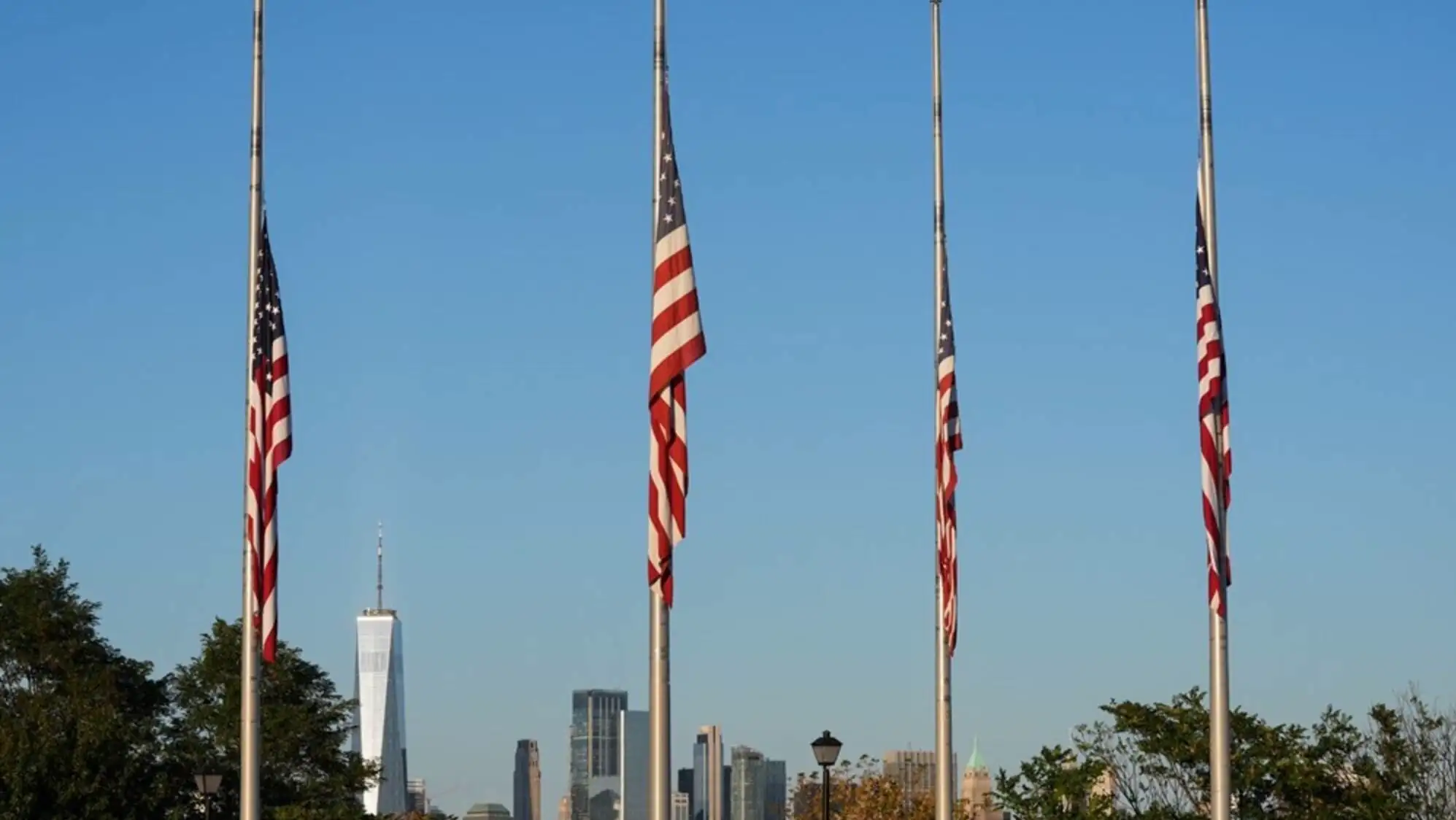 A group of American flags on poles. A group of American flags on poles.