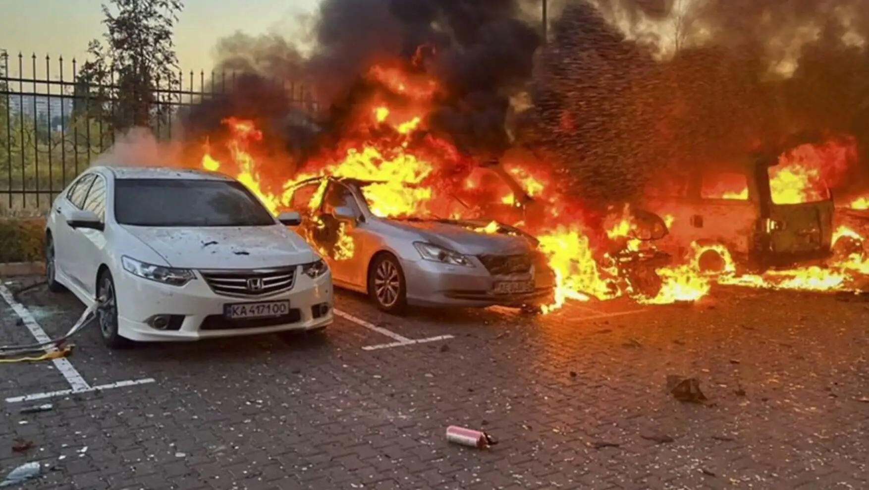 Cars on fire after Russia's airstrike on Ukraine.