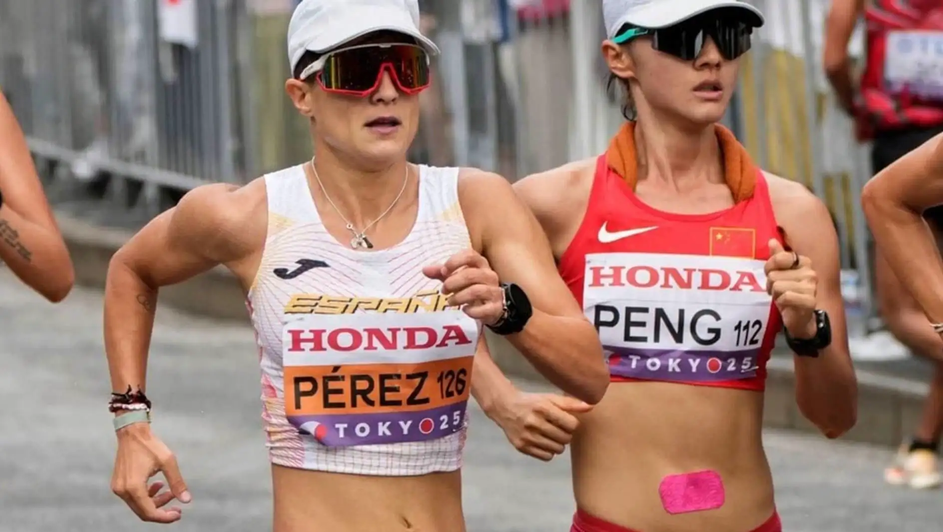 Two women running in a race.