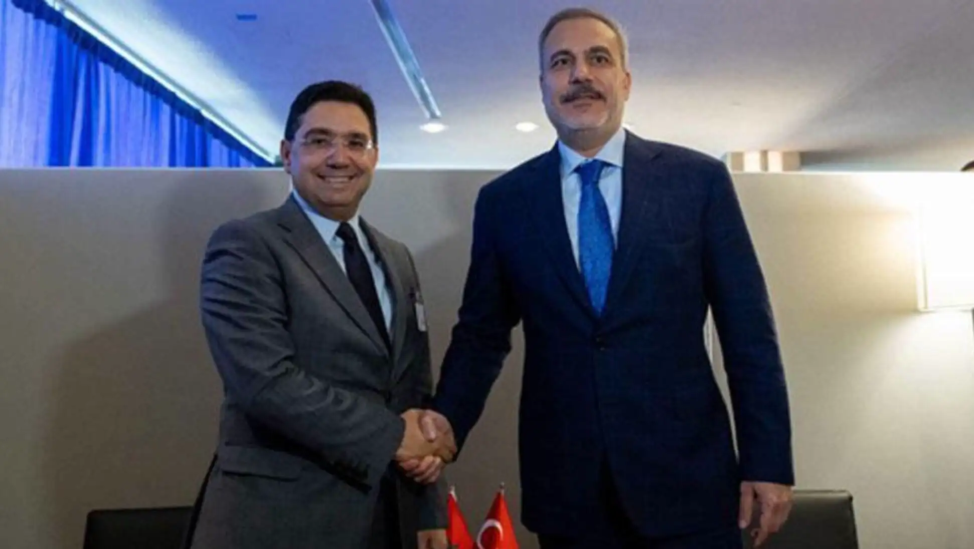 Foreign Minister Hakan Fidan shaking hands with Moroccan counterpart Burita.
