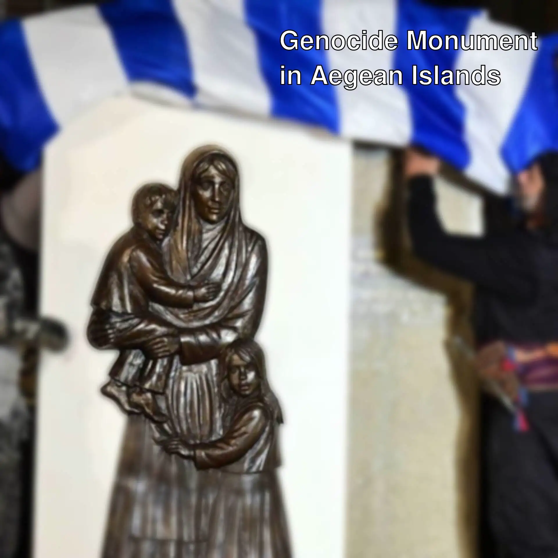 A group of people holding a flag over a statue.