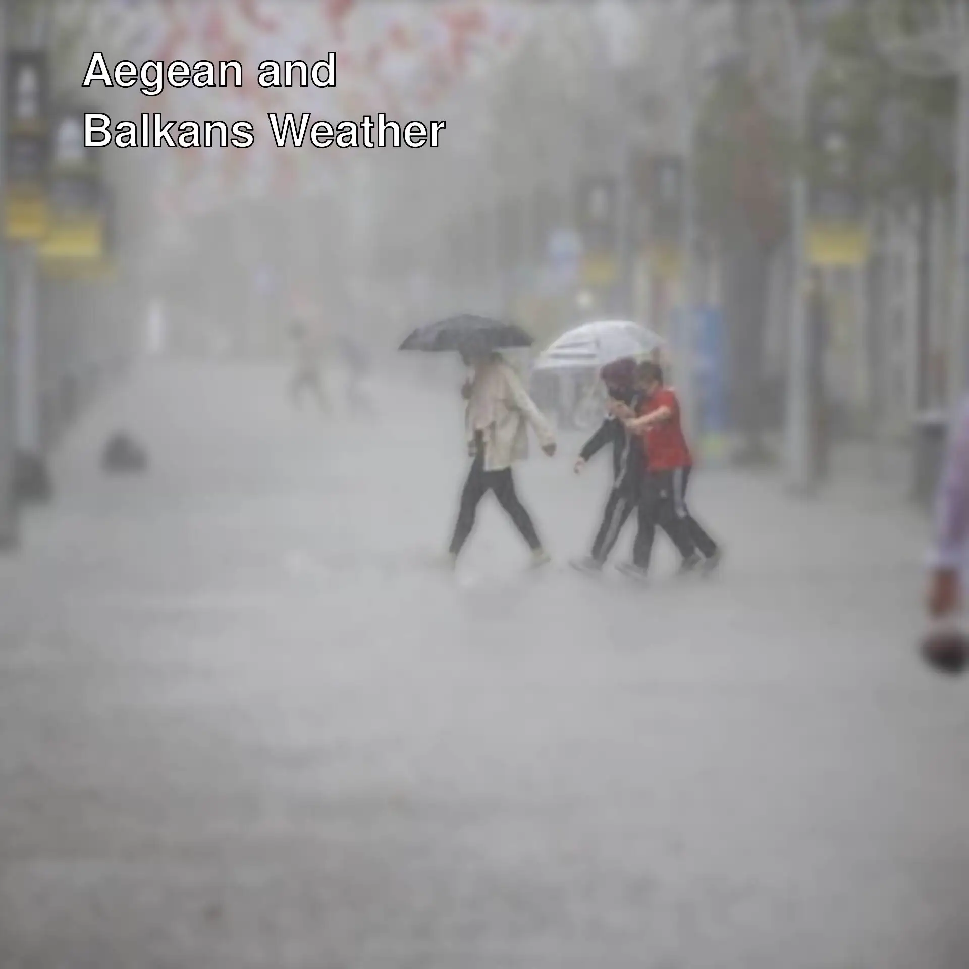 A group of people walking in the rain with umbrellas.