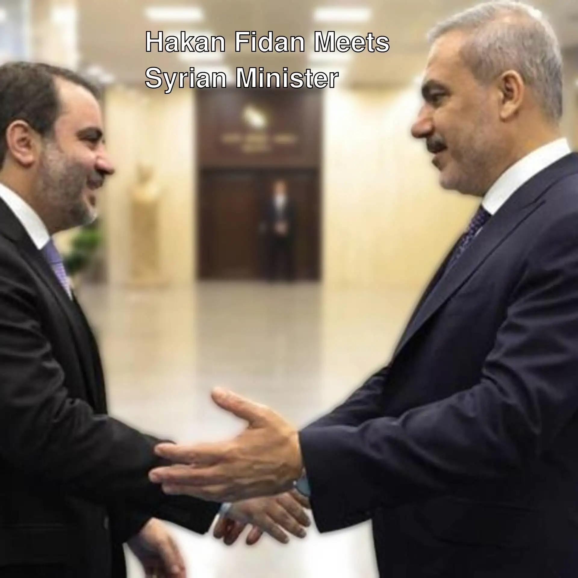 Foreign Minister Hakan Fidan and Syrian Minister shaking hands.