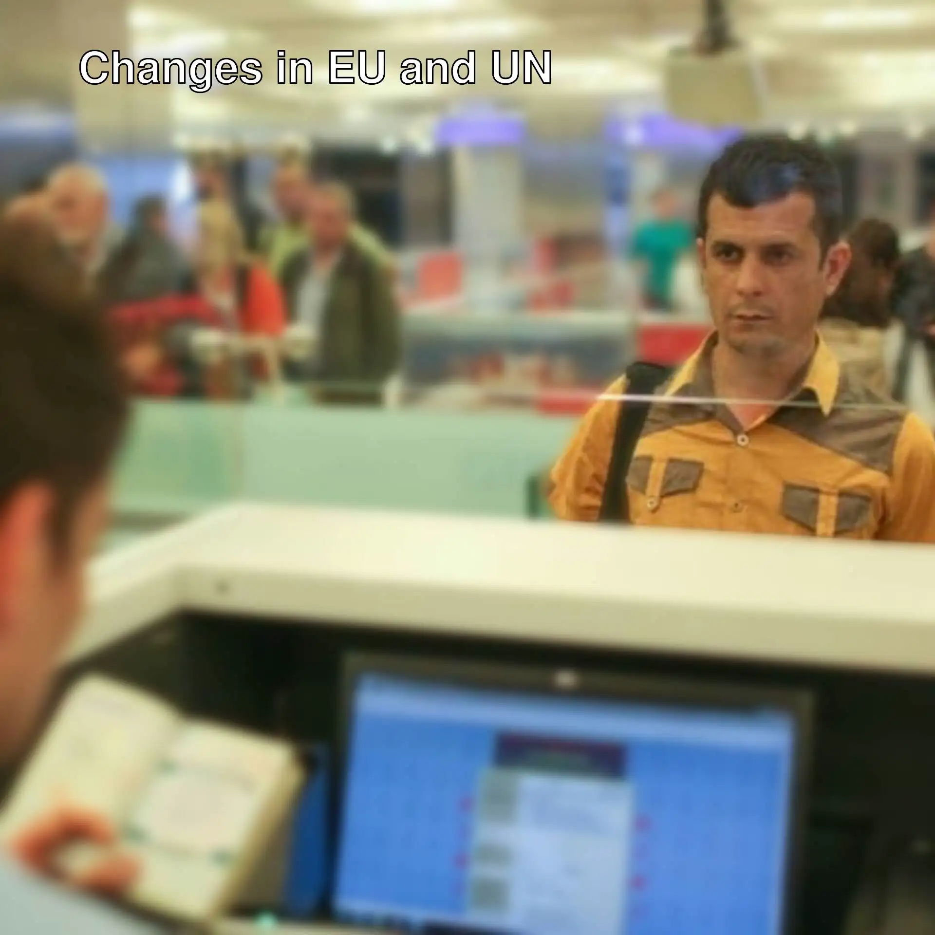 A man explaining the new passport control system.