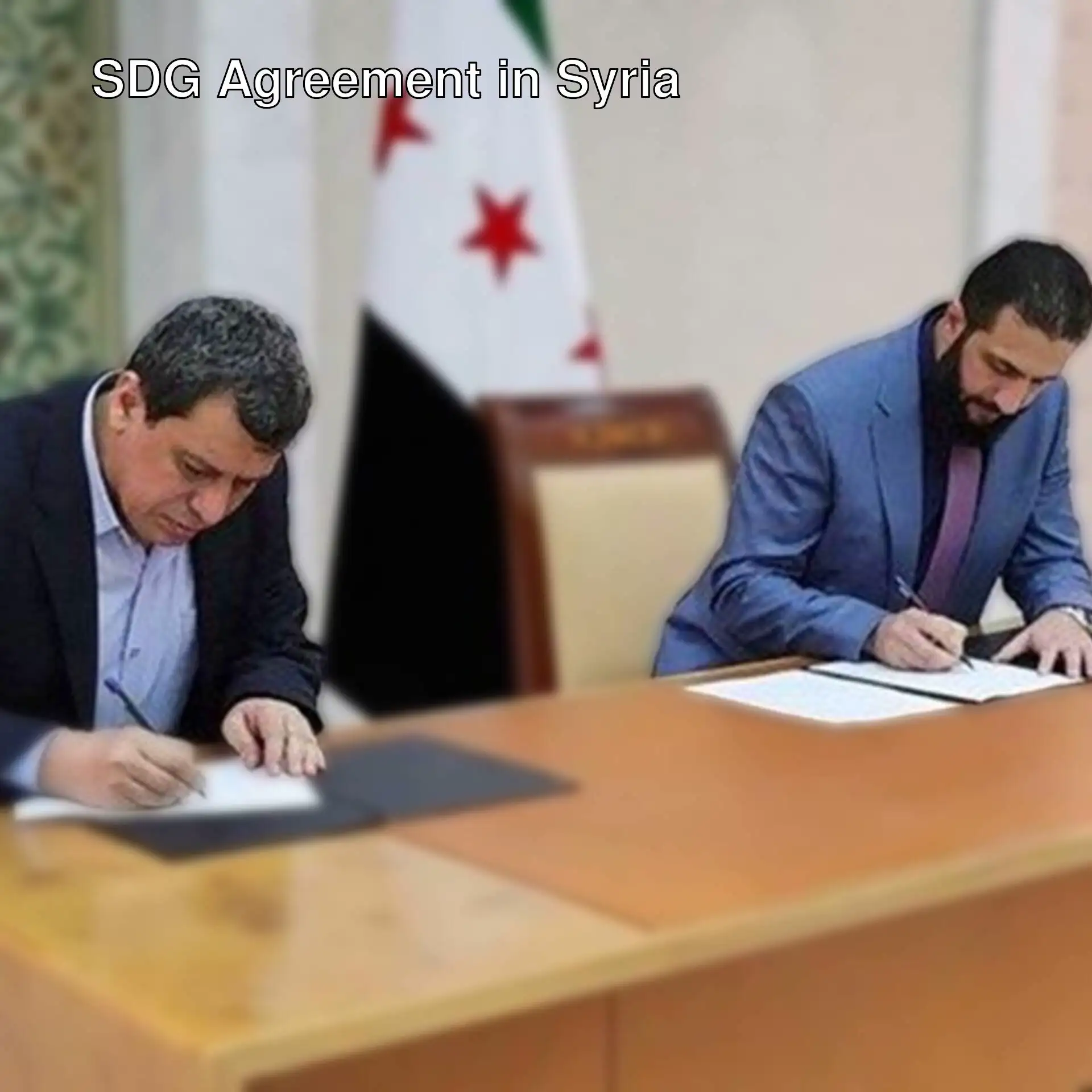 SDG leader Mazlum Abdi and Syrian government representatives signed an agreement. SDG leader Mazlum Abdi and Syrian government representatives signed an agreement.