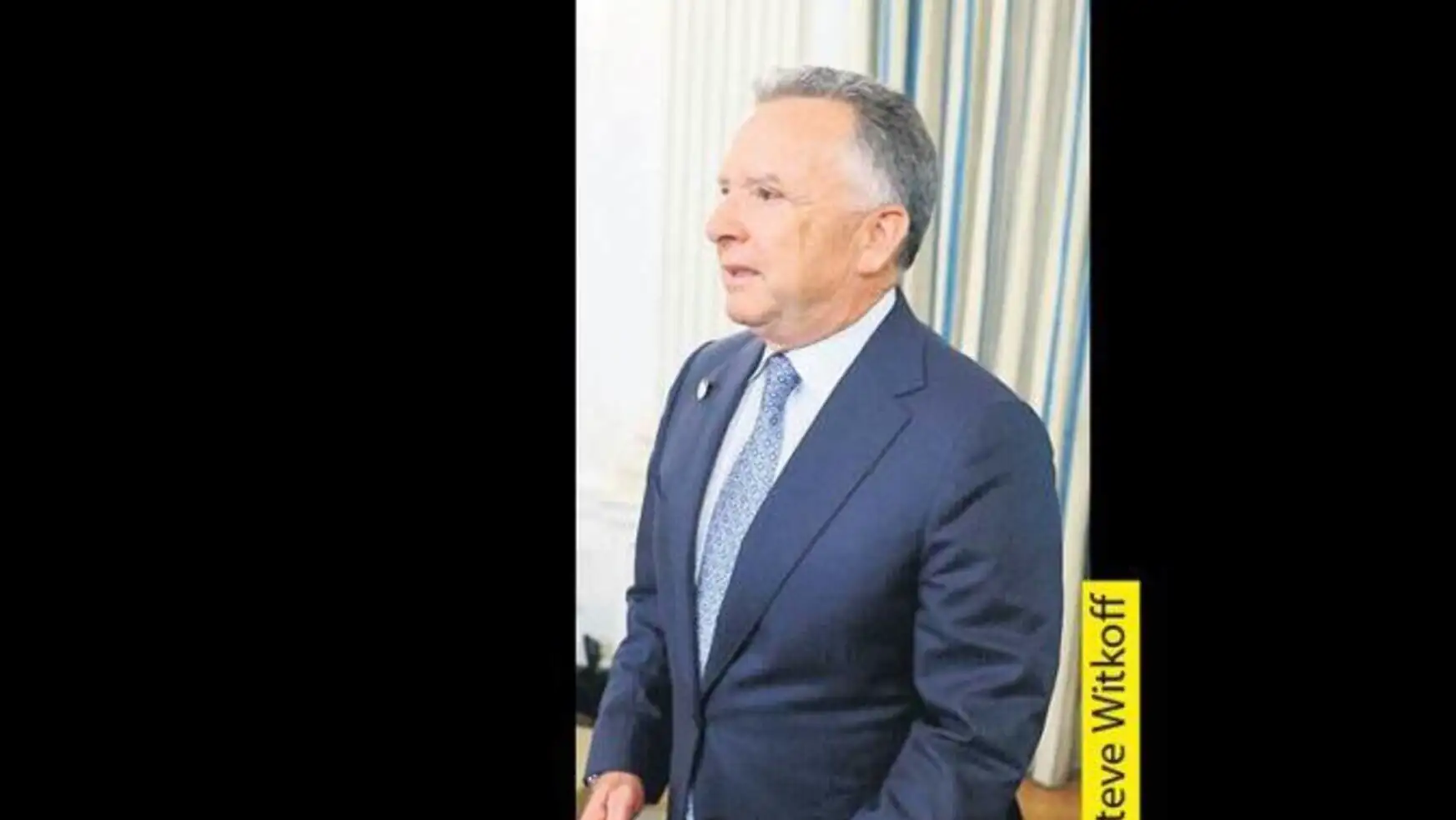 A man in a suit. A man in a suit.